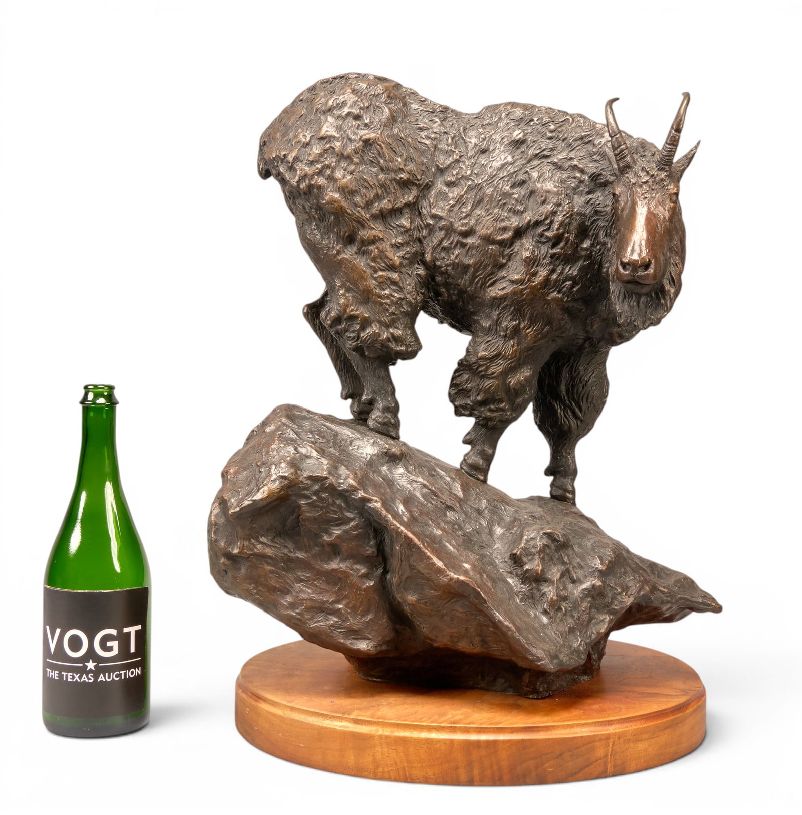 Jack Logozzo, Mountain Goat: Jack Logozzo (Montana, b. 1948), mountain goat perched on rocks, artist-cast bronze sculpture on wooden base, incised signature, edition number 7/10, and date, 1978 height 19 in. x width 24 in. x