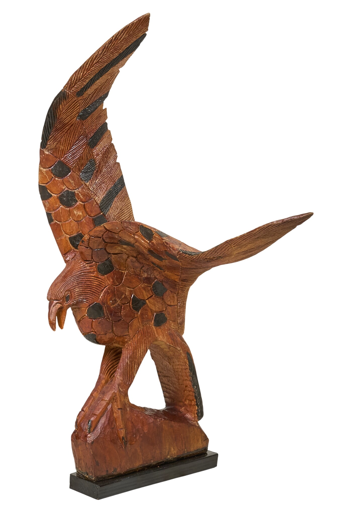 Wooden Eagle Sculpture: Hand-carved folk art sculpture depicting eagle height 45 in. x width 20 in. x depth 28.5 in. Provenance: Property from a home in San Antonio, Texas