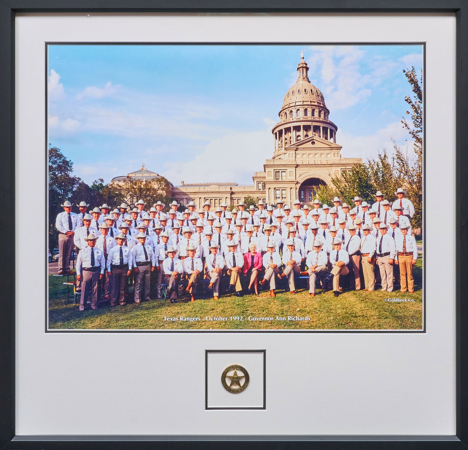 1992 Photo of Governor Ann Richards and Texas Rangers: 1992 Photograph of Governor Ann Richards and all Texas Rangers, by Goldbeck Co.; also includes a Richards Ranger badge made by the official Texas Rangers badge makers from a Mexican