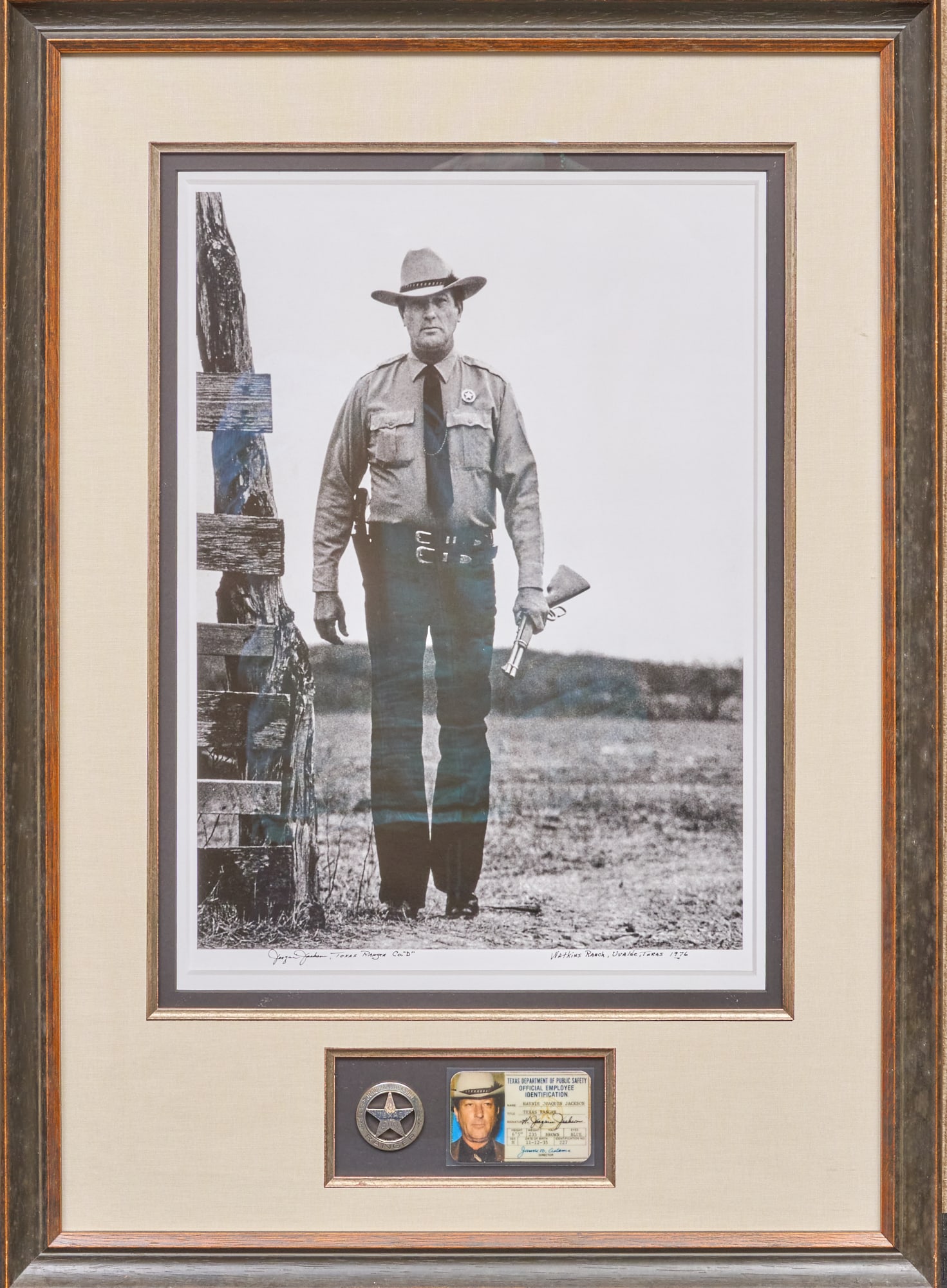 Joaquin Jackson: "Walkin' Tall" Photograph and Badge: "Walkin' Tall" 1976 photograph of legendary Texas Ranger Joaquin Jackson: on a manhunt near Uvalde, Texas; includes an exact duplicate of his personal badge and ID card, and