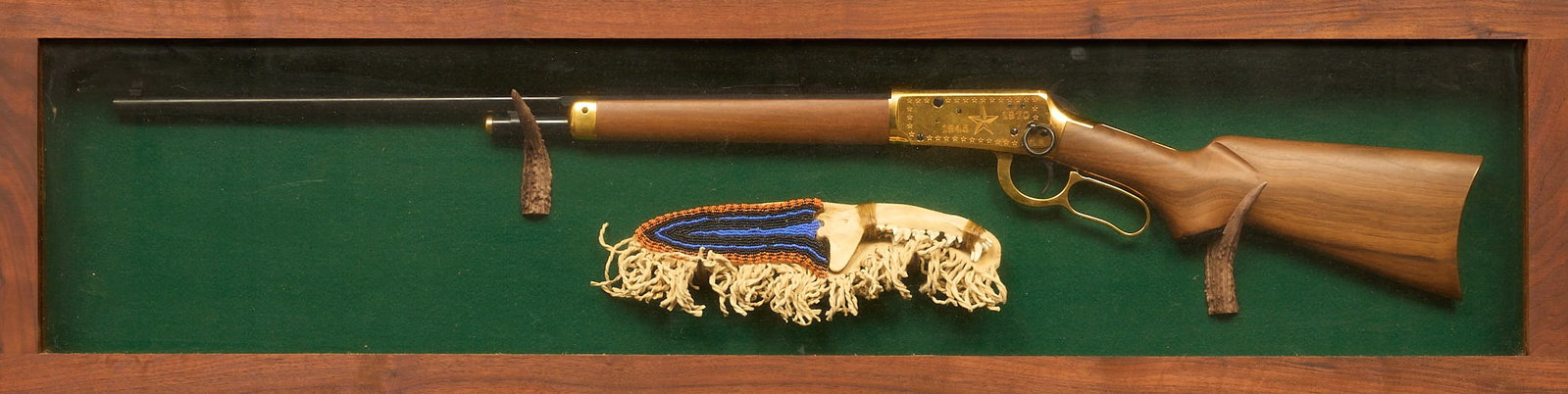 Winchester Model 94 Lone Star Commemorative Rifle with Knife: Winchester Model 94 Lone Star Commemorative edition rifle, serial number LS12132, featuring a gold-plated receiver with intricate engravings and a wooden stock, includes a knife with a beaded