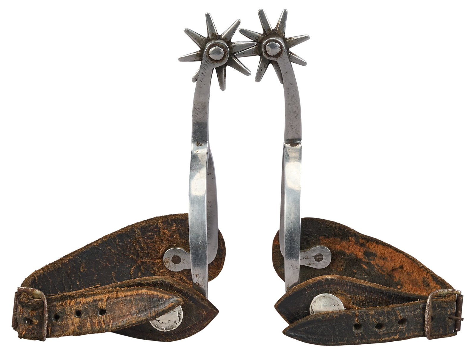 Pair of Louis Traylor Spurs: Pair of Louis Traylor spurs with coin motif buttons, circa early 1900s overall length: 6 in. heel width: 3.5 in. rowel diameter: 1.25 in. Provenance: Property from a San Antonio, Texas col