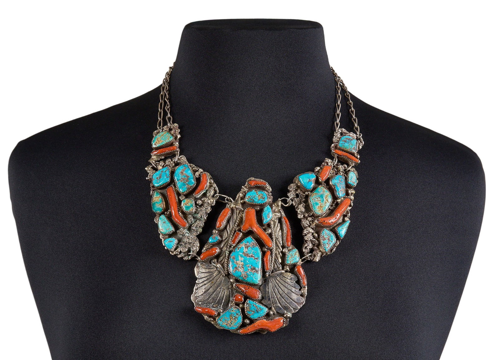 Sterling Silver Turquoise & Coral Necklace: Sterling silver necklace, set with turquoise and coral stones, featuring twisted wire and leaf motifs, signed to reverse Length: 18 in. Total weight: 217.5 g Provenance: Property from a home in S