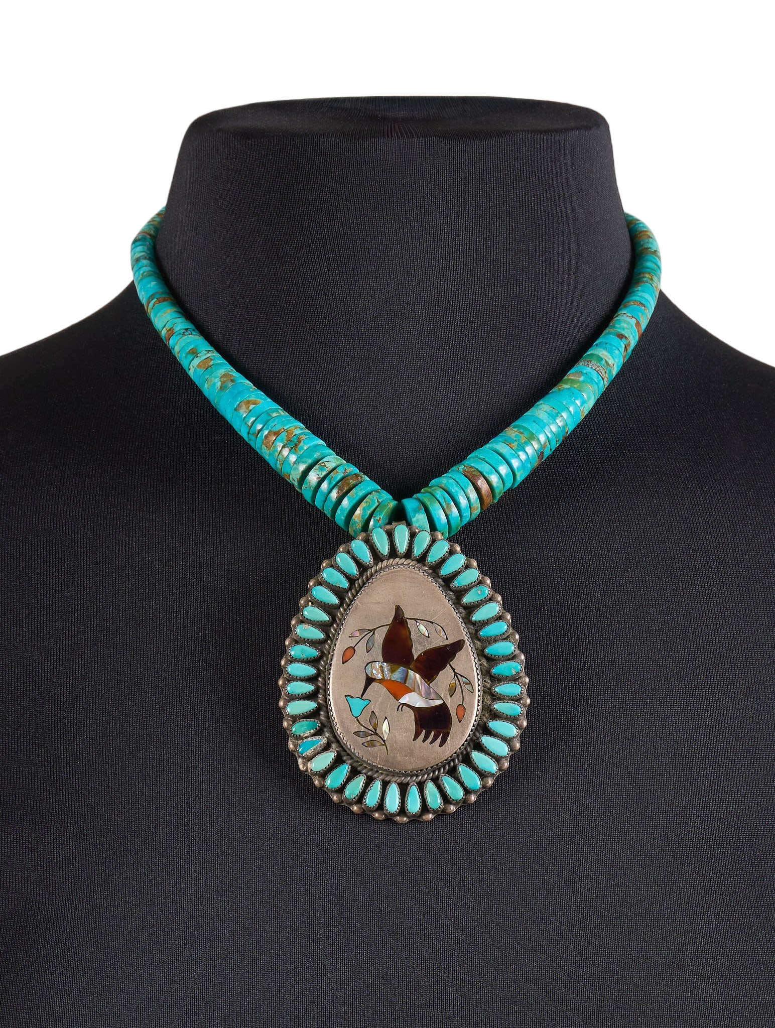Zuni Multi-Stone Inlay Hummingbird Pendant Necklace: John B. Hawley, turquoise beaded pendant necklace, sterling silver pendant set with multi-stone inlay in hummingbird motif, accented by turquoise cabochon border, signed "JBH" Length: 1