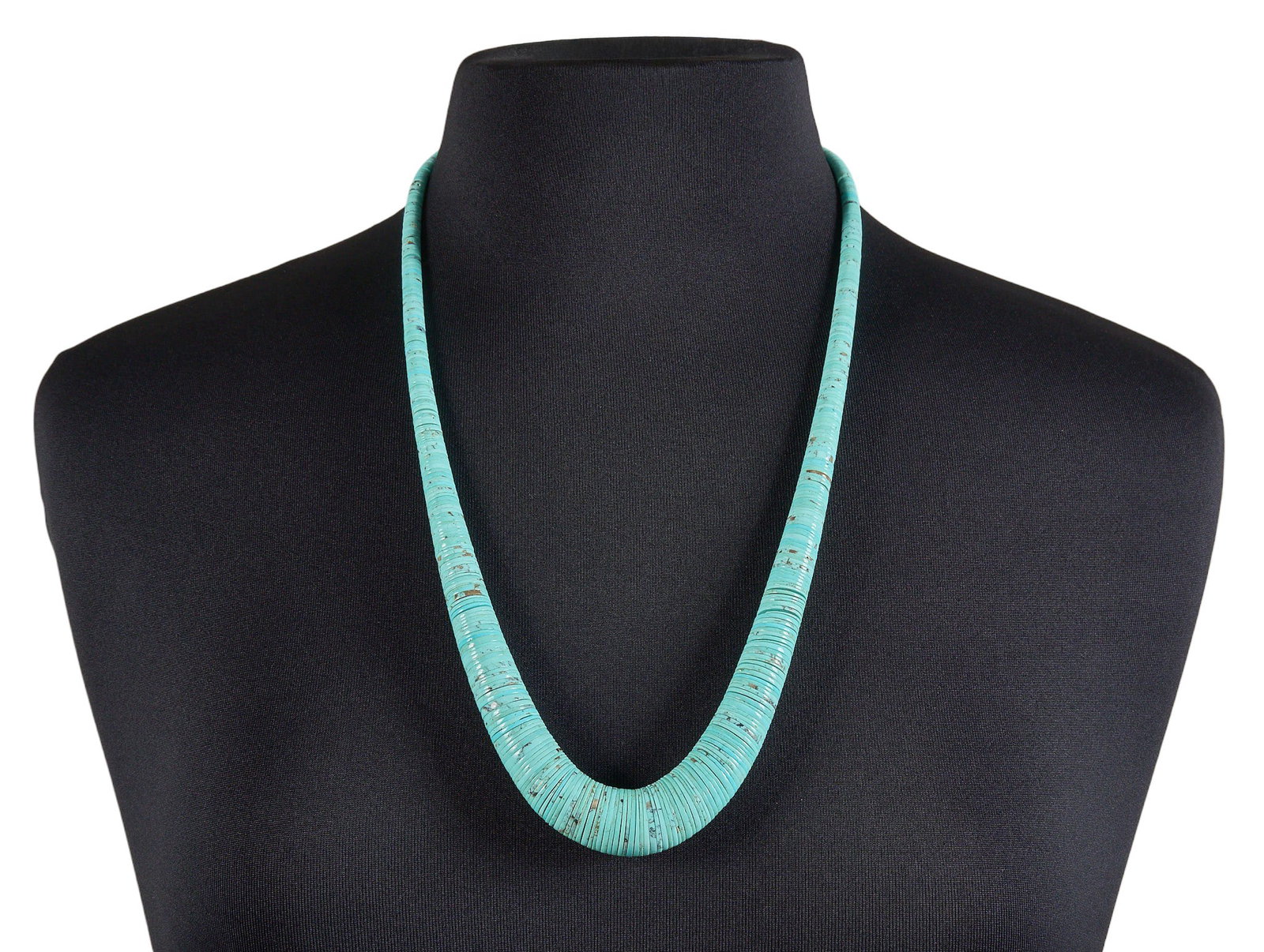 Turquoise Flat-Beaded Necklace: Turquoise flat-beaded necklace with sterling silver hook and eye closure, possibly by Tony Aguilar, marked "Sterling" near clasp Length: 26 in. Total weight: 86.8 g Provenance: Property