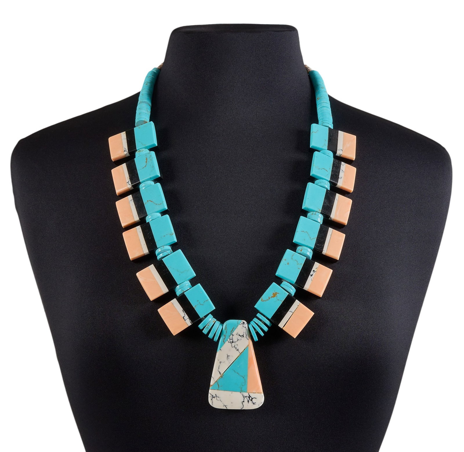 Santo Domingo Beaded Necklace: Santo Domingo beaded necklace, composed of natural rolled heishi and block turquoise, coral, and onyx, in an inlaid design Length: 28 in. Total weight: 226.2 g Provenance: Property from an Austin