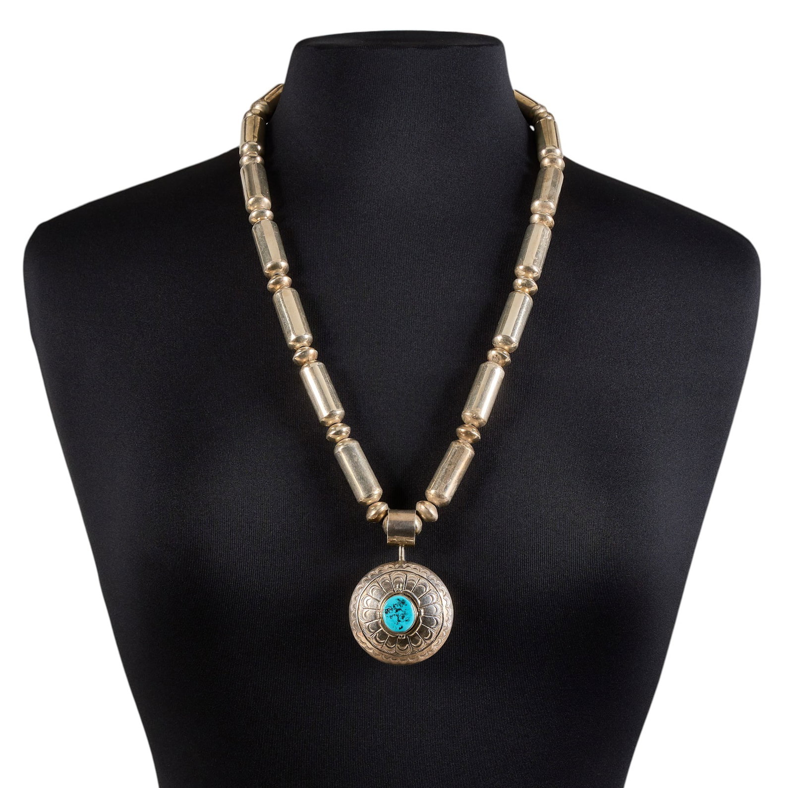 Sterling & Turquoise Reversible Pendant Necklace: Sterling silver pendant necklace, with reversible pendant featuring single turquoise stone to one side, and figural motif to reverse, marked "Sterling" to beads Length: 28 in. Total wei