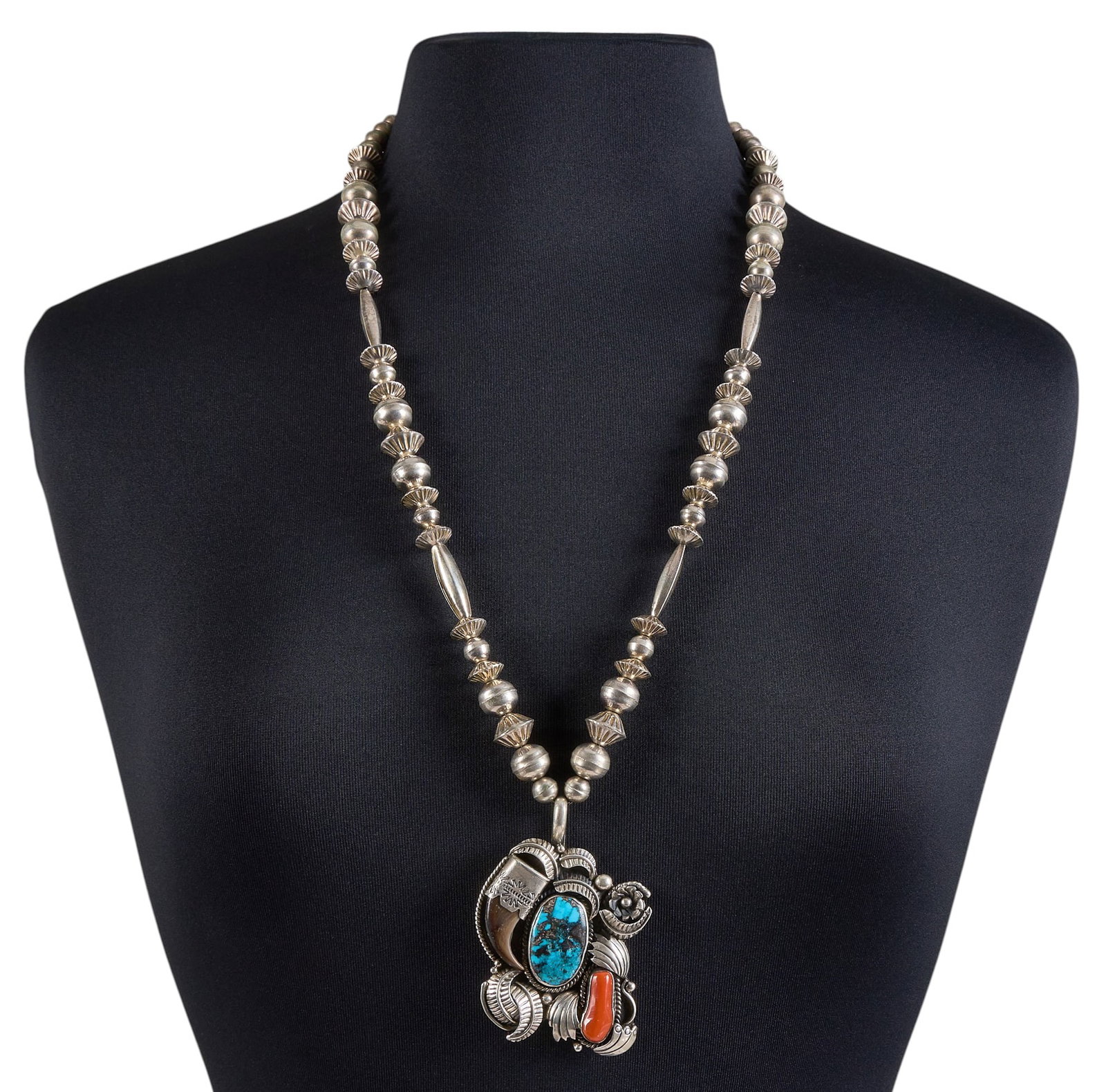 Navajo Turquoise & Coral Bear Claw Pendant Necklace: Navajo sterling silver pendant necklace, pendant set with turquoise and coral cabochons, with bear claw detail and feather motifs, marked "KEH" to pendant Length: 29 in. Total weight: 106.1 