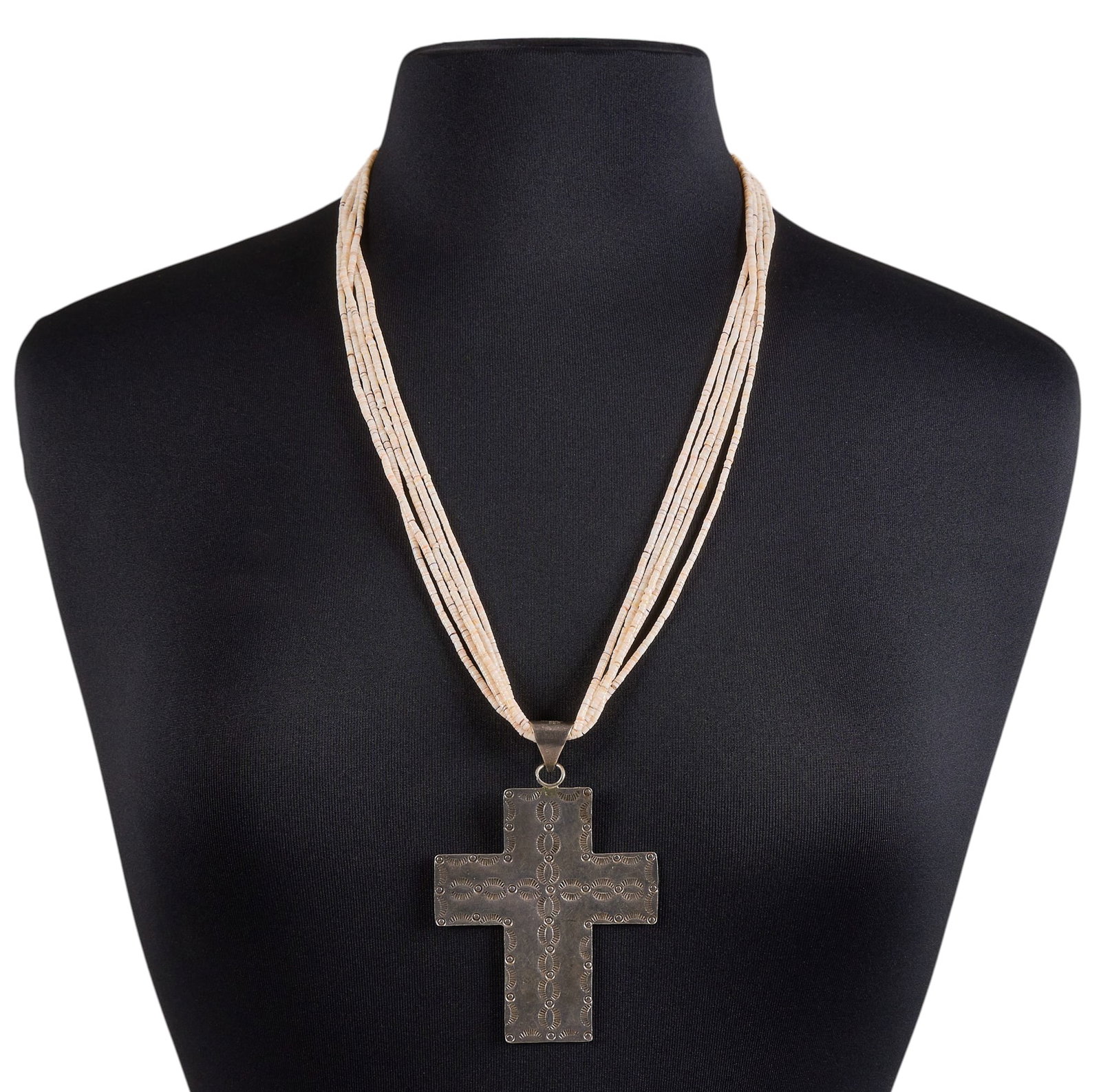 Native American Cross Pendant Heishi Necklace: Navajo sterling silver stamped cross pendant, with mexican sterling bail, on a Santo Domingo five-strand melon heishi necklace Length: 27 in. Total weight: 64.3 in. Provenance: Property from an 