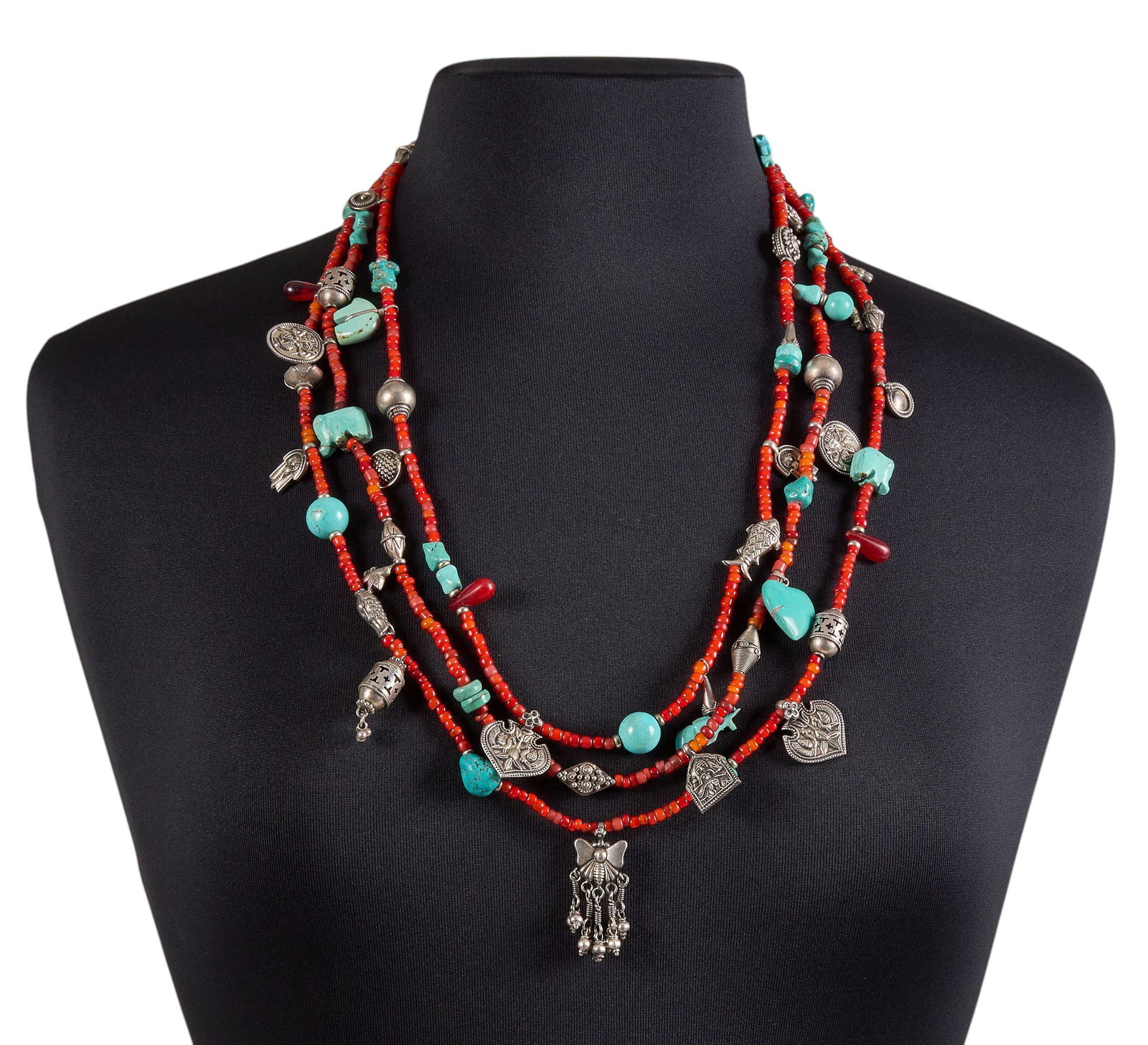 Southwestern Style Sterling & Multi-Stone Beaded Necklace: Southwestern style multi-strand necklace, featuring turquoise and coral beads, sterling silver charms, and hook and eye closure, marked "925" to charms Length: 30 in. Total weight: 153.