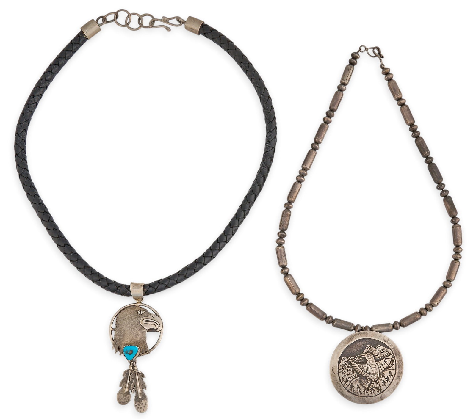 (2) Southwestern Sterling Bird Motif Pendant Necklaces: Two Southwestern pendant necklaces, each sterling silver pendant featuring bird motifs, one pendant set with turquoise stone, both signed Length: 20 in. / each Total weight: 103.5 g Provenance: P