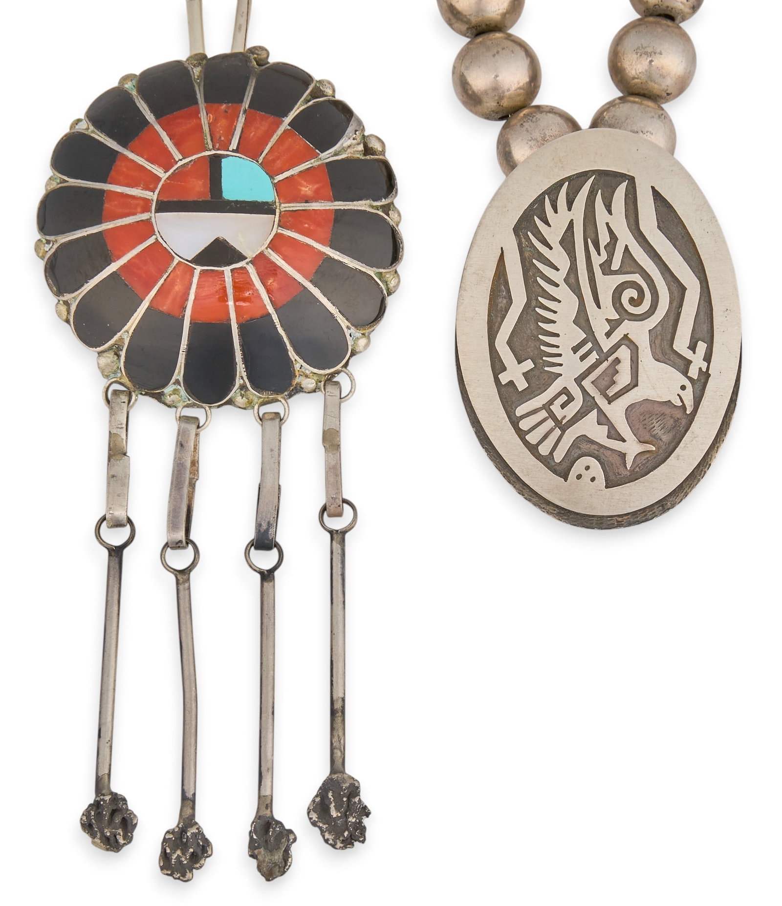 (2) Native American Pendant Necklaces: Two Native American pendant necklaces, to include one Zuni sun face pendant on handmade chain, and a Hopi pendant necklace by Nathan Fred Length: 26 in. / longest Total weight: 107.5 g Provenance