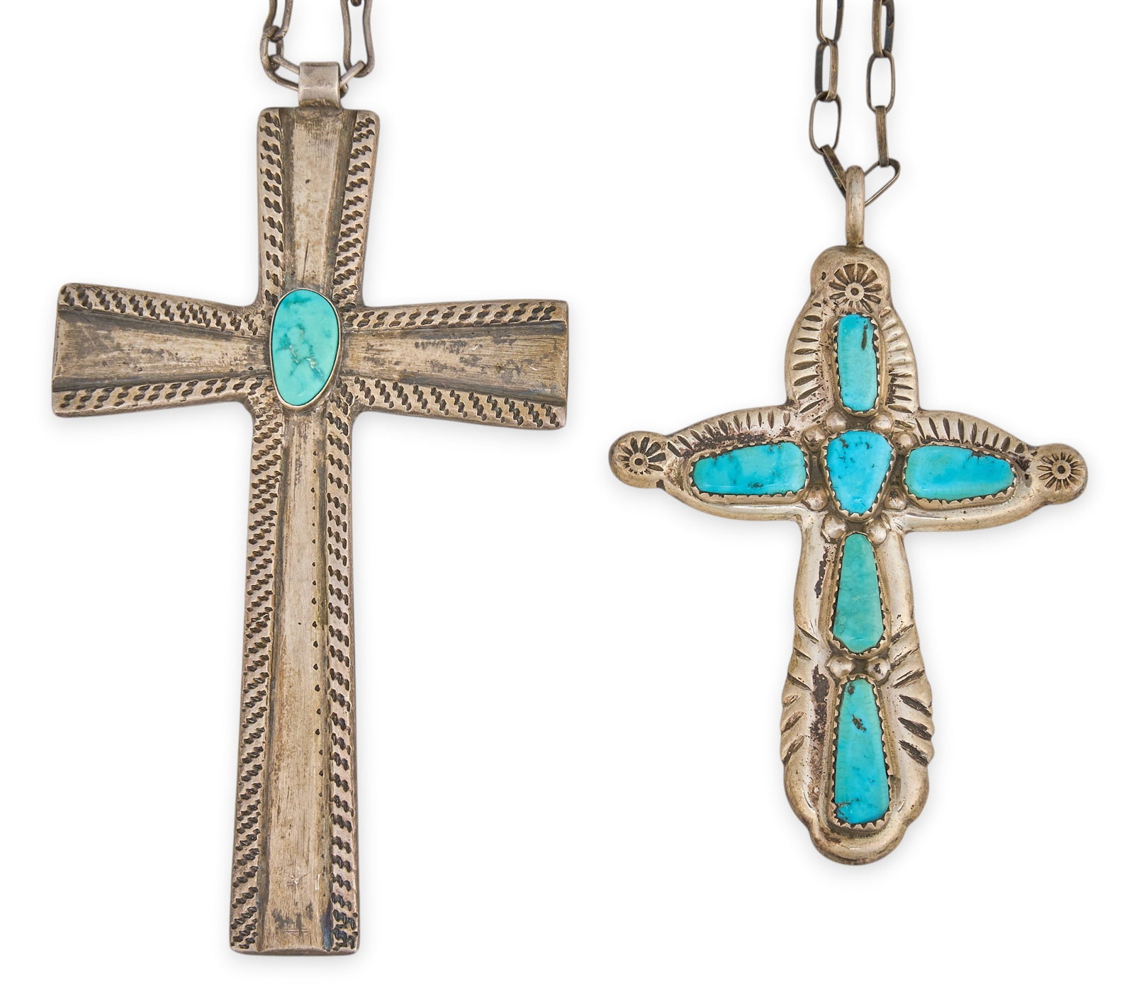 (2) Native American Sterling & Turquoise Cross Pendant Necklaces: Two sterling silver necklaces to an include a Navajo cross pendant on handmade chain, circa 1950s and a Zuni cross pendant signed "G&L Leekity" on handmade chain, circa 1970s Size:
