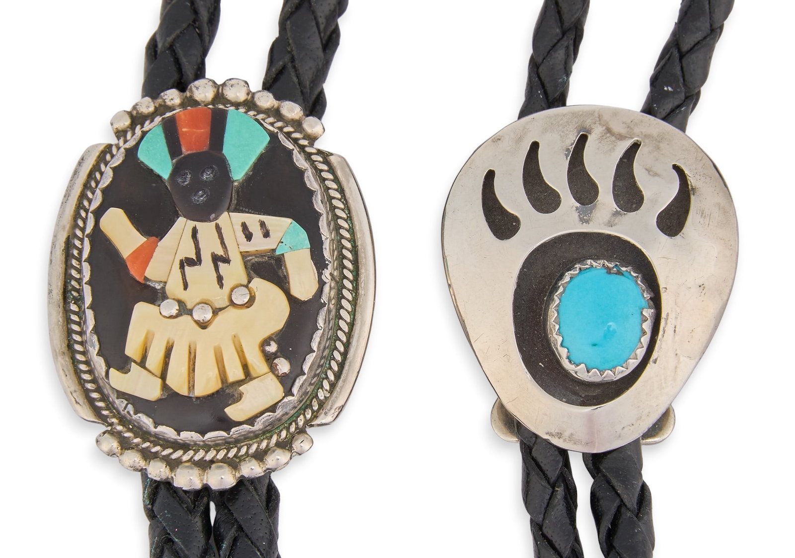(2) Sterling & Multi-Stone Bolo Ties: Two bolo ties, one set with multi-stone inlay depicting traditional dancing figure, the other set with single turquoise cabochon in shadowbox style setting, depicting bear paw motif, each on braided b