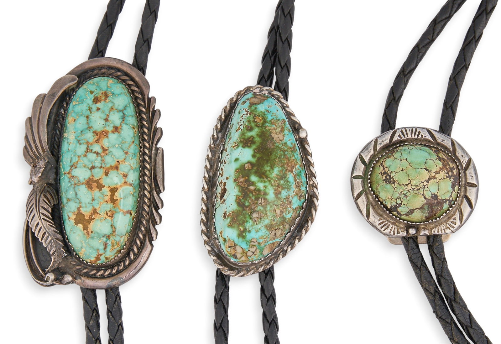 (3) Sterling & Turquoise Bolo Ties: Three sterling silver bolo ties, each set with single green matrix turquoise stone, featuring twisted wire motifs and stamped details, on braided black leather cords, one pendant marked "ROBT KEL