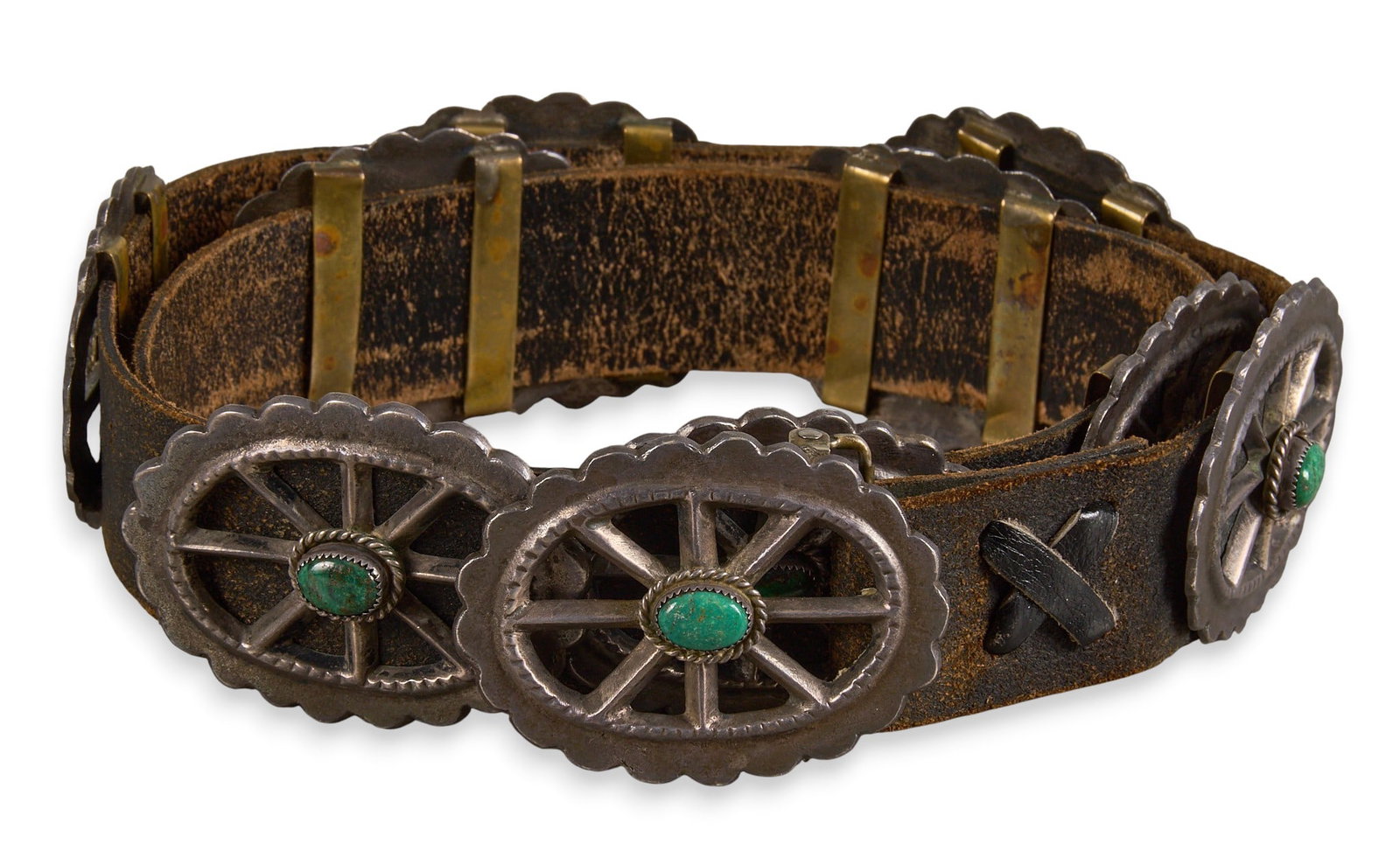 Tufa Sterling & Green Turquoise Concho Belt: Tufa cast sterling silver concho belt, with nine conchos and buckle, set with turquoise cabochons, buckle marked "Sterling" with hallmark Length: 41 in. Total weight: 725.4 g Provenance: Pro