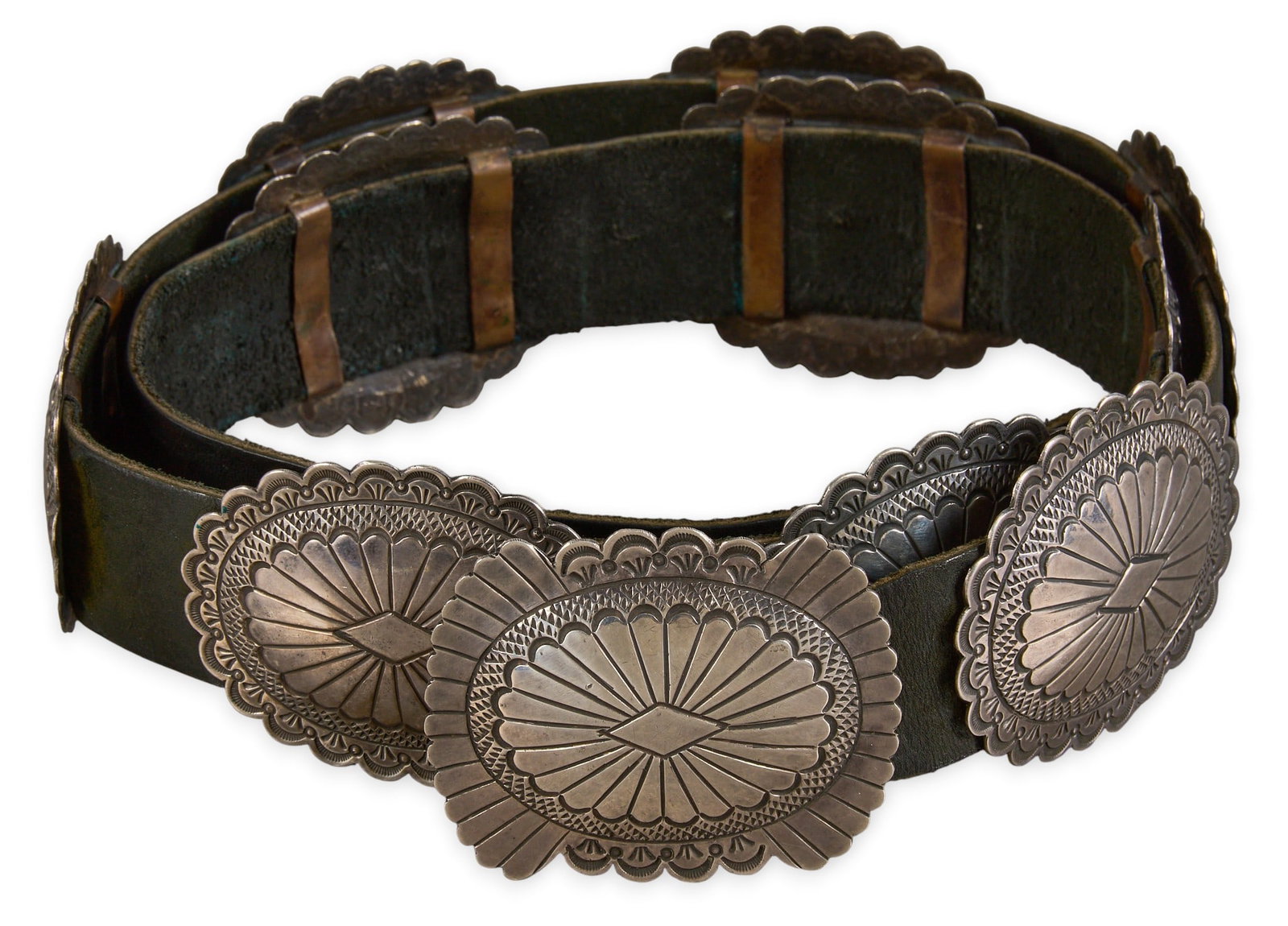 Sterling Silver Concho Belt: Sterling silver concho belt with ten conchos and buckle on black leather belt, circa 1980s Length: 49 in Total weight: 480.3 g Provenance: Property from an Austin, Texas estate