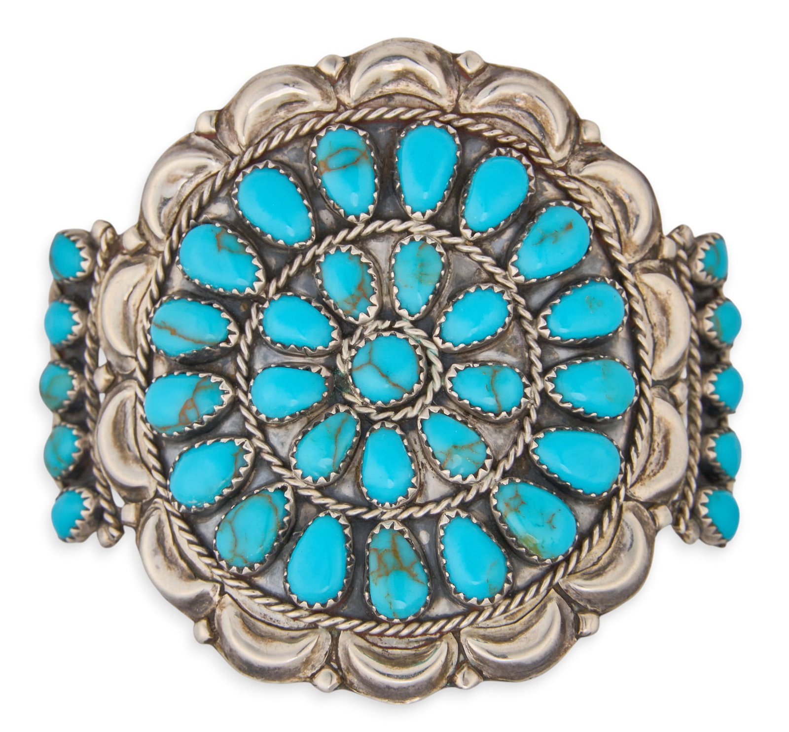 Sterling & Turquoise Cluster Cuff: Sterling silver cuff bracelet set with turquoise cabochons in cluster design, marked DLW Sterling Circumference: 7 in. Total weight: 31.9 g Provenance: Property from a home in San Antonio, Texas
