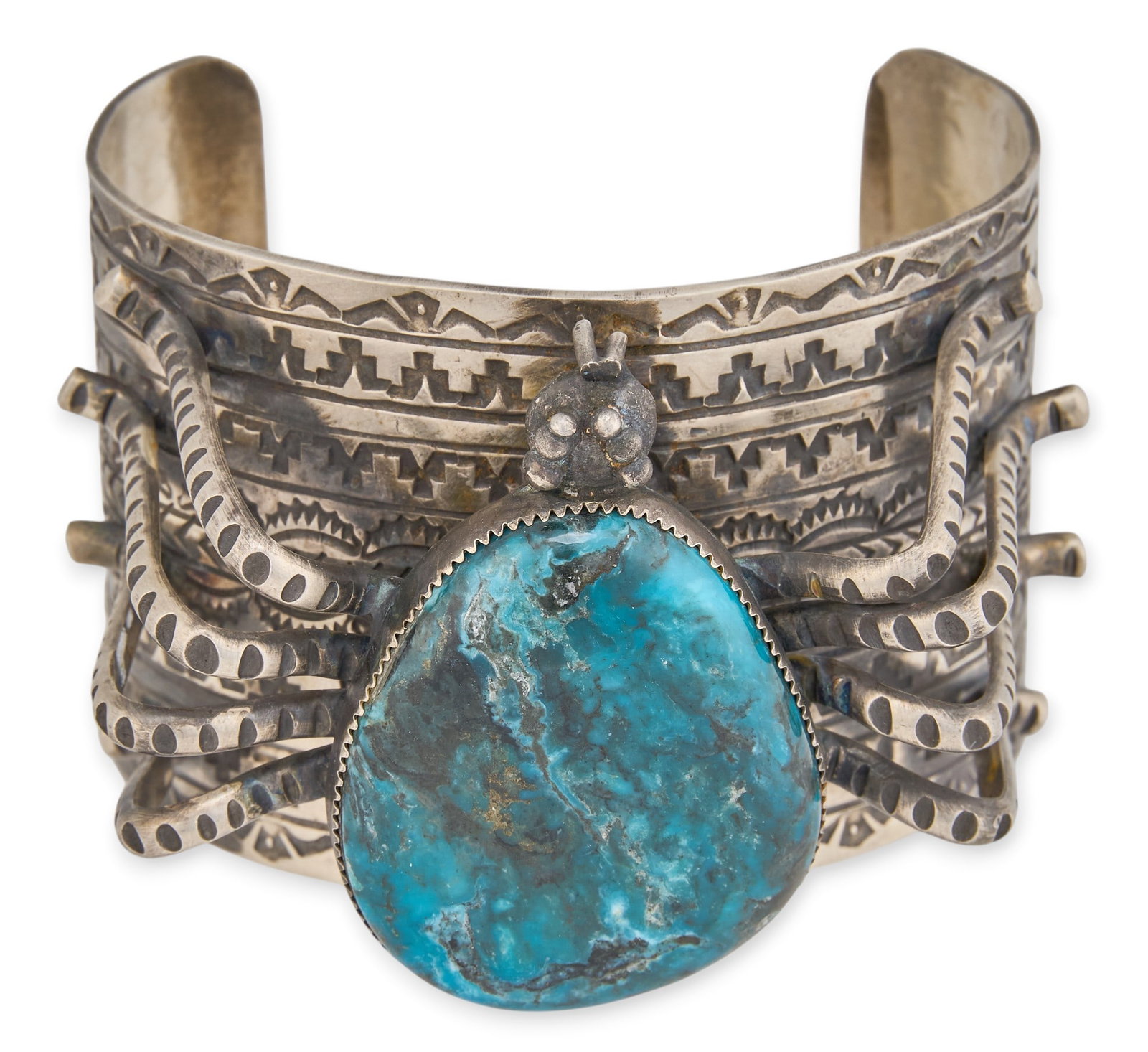 Jacob Troncosa, Substantial Sterling & Turquoise Spider Cuff: Jacob Troncosa (San Felipe/Cochiti Pueblo), substantial sterling silver cuff bracelet, set with large turquoise stone and spider motif, featuring stamped details throughout, signed and marked