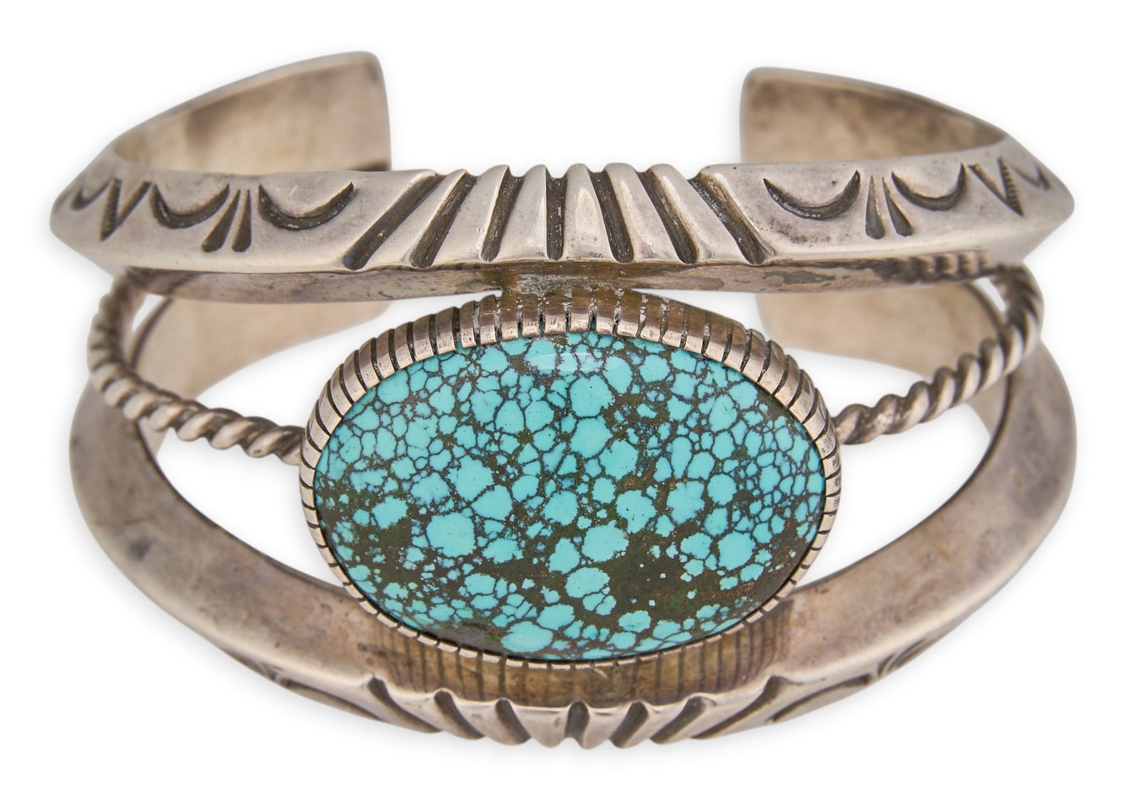 Naive American Sterling & Turquoise Cuff: Native American sterling silver cuff bracelet, set with single large turquoise stone, with twisted wire motifs and stamped details, signed "JB", possibly Jonathan Beyuka Circumference: 
