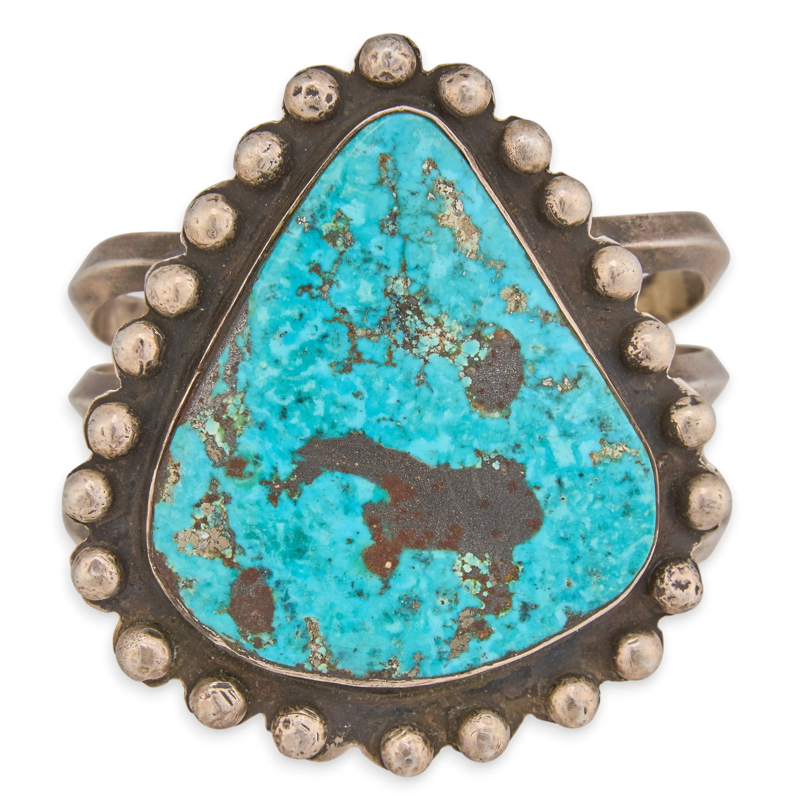 Navajo Sterling & Turquoise Cuff: Navajo sterling silver cuff bracelet, set with single large turquoise stone, and textured border Circumference: 6.5 in. Total weight: 80.3 g Provenance: Property from a home in San Antonio, Texas