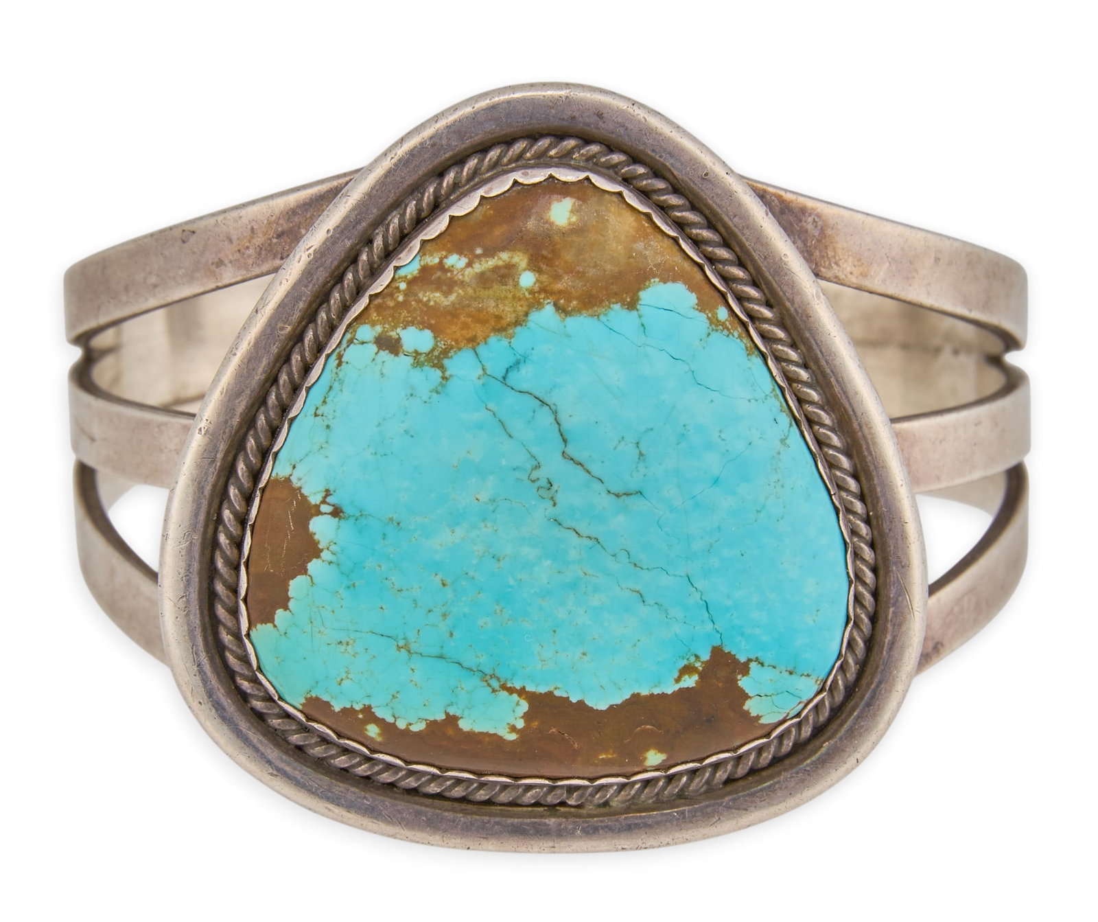 Navajo Sterling & Turquoise Cuff: Navajo sterling silver cuff bracelet, set with single large turquoise stone, in twisted rope style bezel, signed "PJ Sterling Navajo" Circumference: 6.25 in. Total weight: 61.3 g Proven