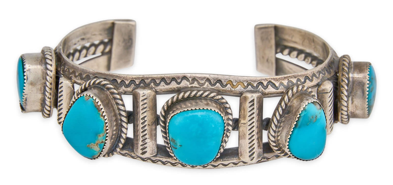 Navajo Sterling Silver & Turquoise Cuff: Navajo sterling silver cuff bracelet, set with five turquoise stones in twisted rope motif settings, featuring stamped details throughout, marked "SD" Circumference: 6.75 in. Total weight: