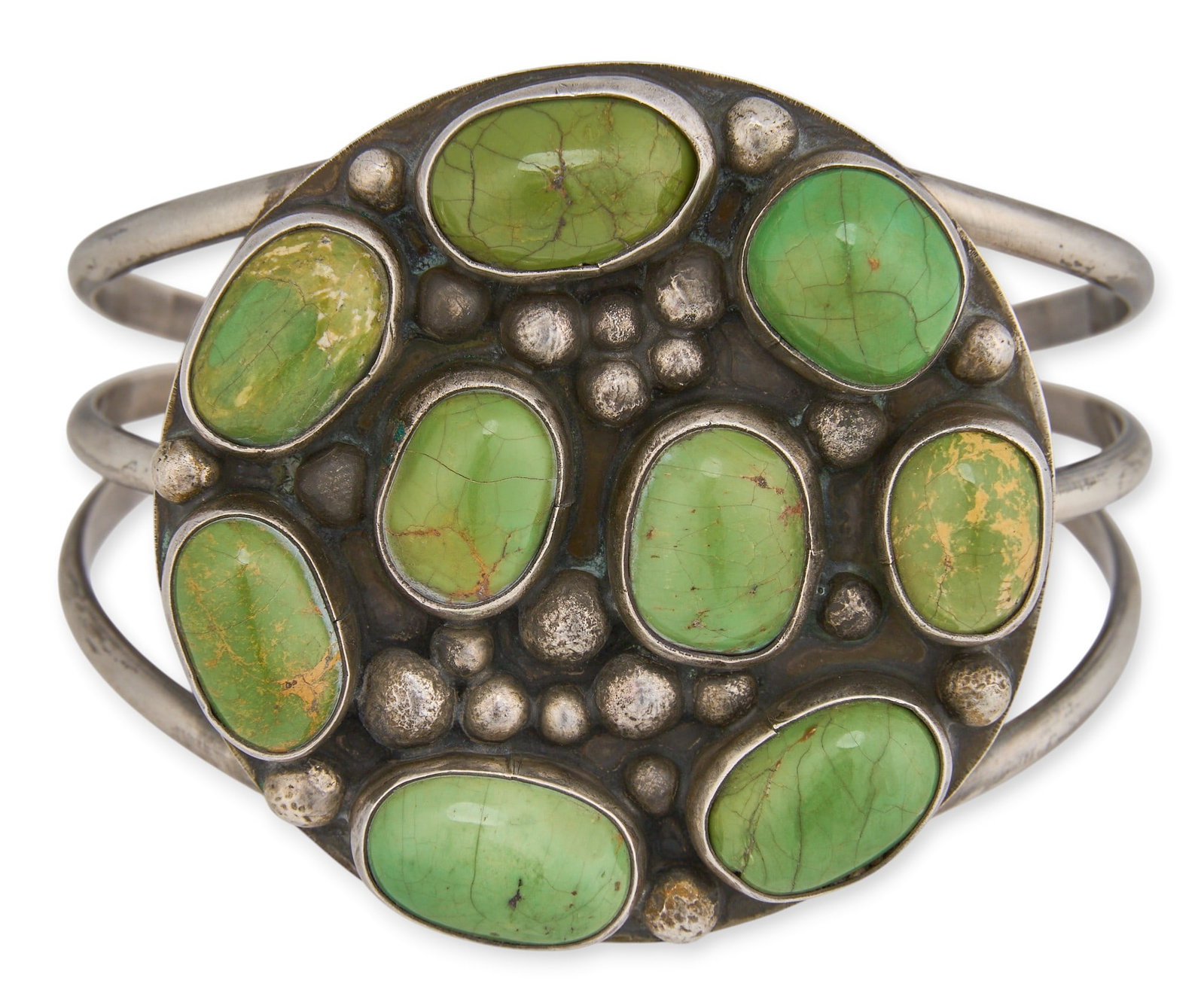 Sterling & Green Turquoise Cluster Cuff: Sterling silver cuff with green turquoise cluster setting, marked J Circumference: 6.75 in. Total weight: 55.9 g Provenance: Property from a home in San Antonio, Texas