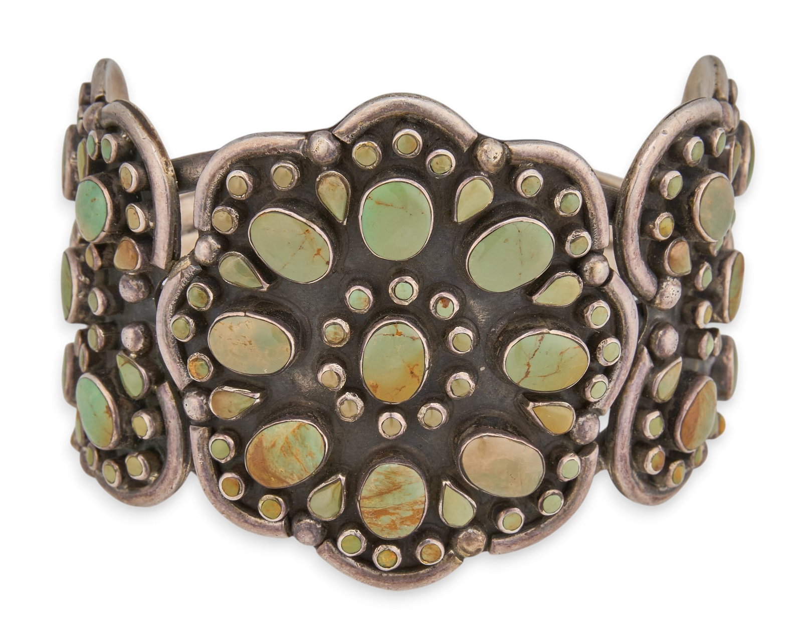 Navajo Sterling & Green Turquoise Cuff: Navajo sterling silver cuff bracelet, set with green turquoise cabochons in cluster design, signed "DC" and marked "Sterling" Circumference: 7 in. Total weight: 128.7 g