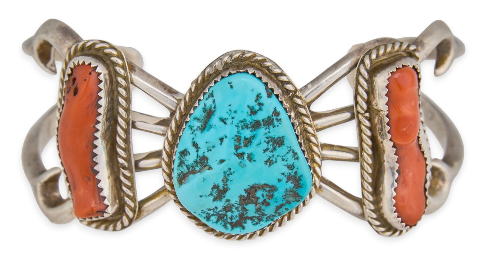 Sterling Silver Turquoise & Coral Cuff: Sterling silver cuff bracelet set with turquoise and red coral, marked Sterling Circumference: 7 in. Total weight: 50.1 g Provenance: Property from a home in San Antonio, Texas