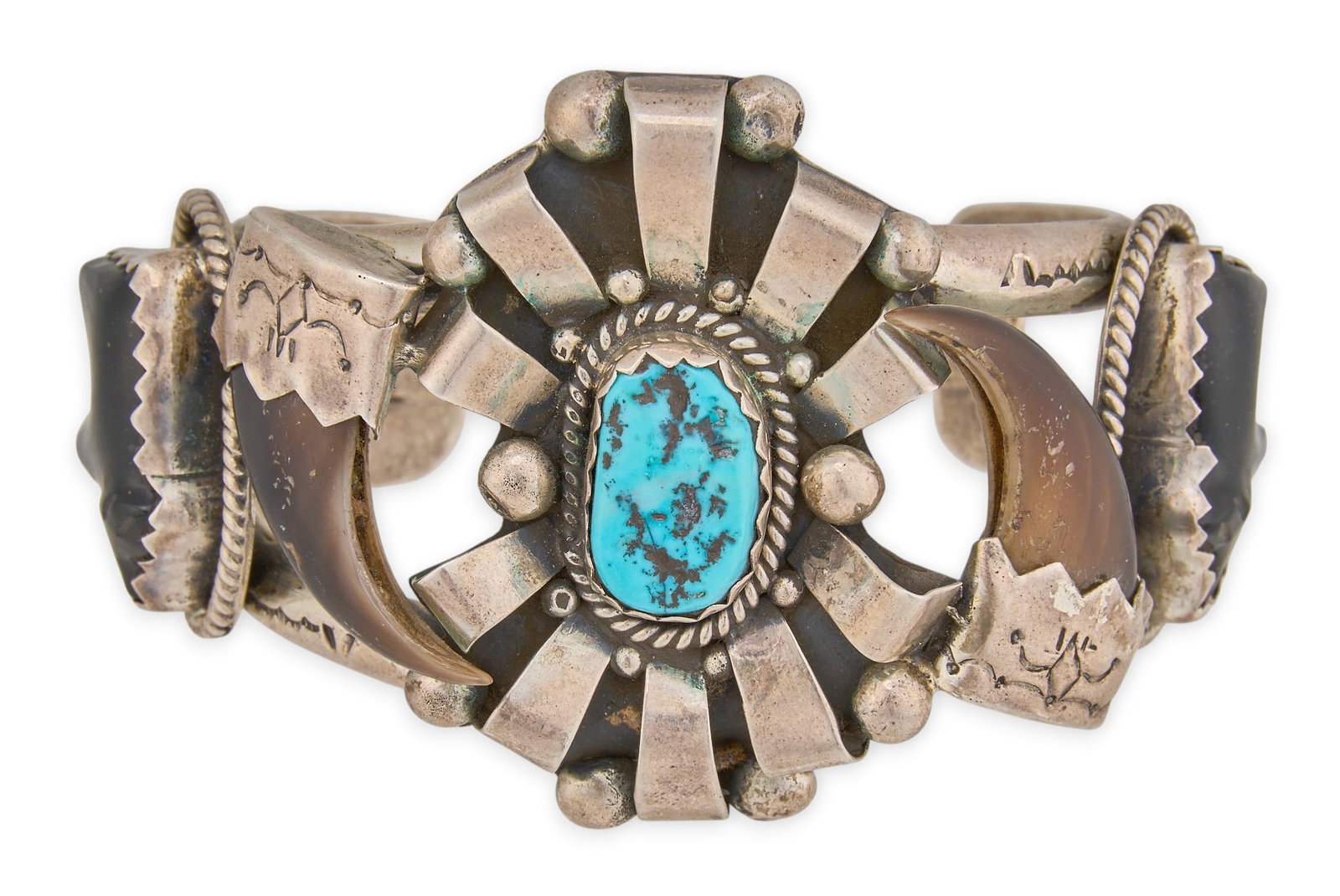 Lorenzo B. Coriz, Turquoise, Onyx, and Bear Claw Cuff: Lorenzo B. Coriz (Santo Domingo Pueblo), vintage sterling silver cuff bracelet, set with turquoise center stone, carved bear motif onyx, and bear claws, featuring twisted rope and stamped motifs throu