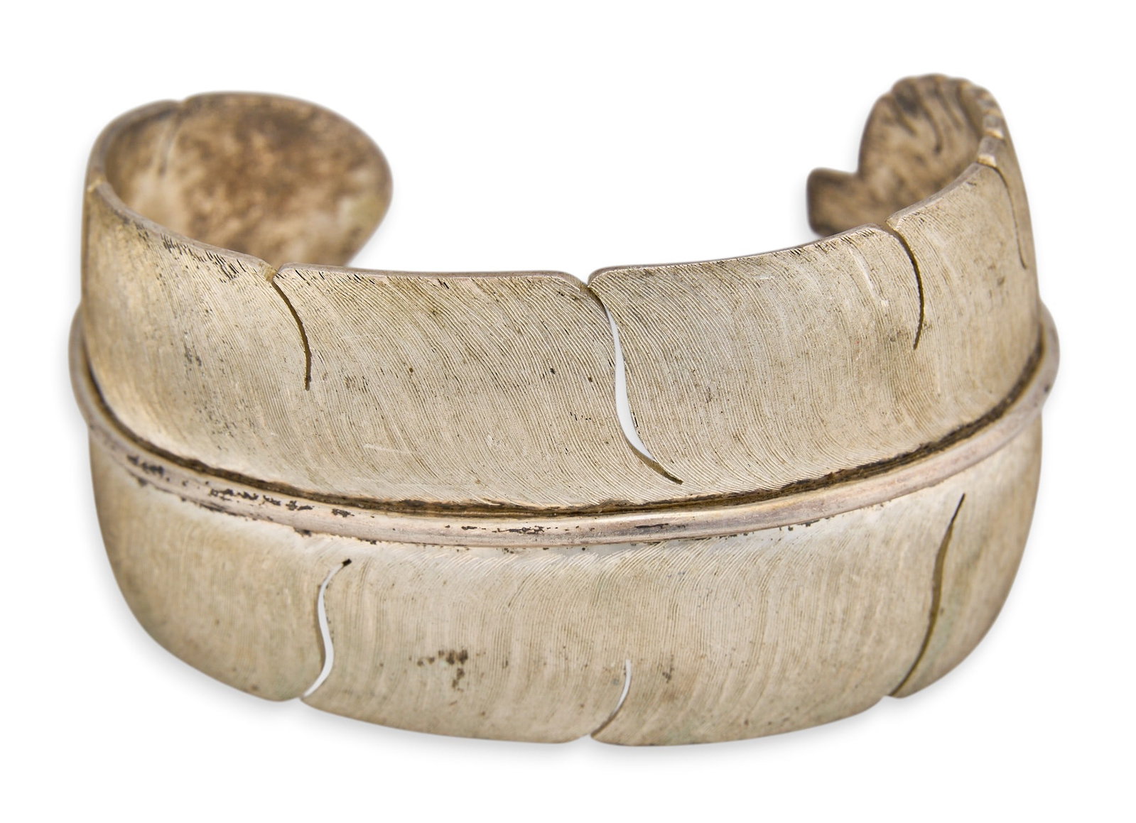 Sterling Silver Feather Cuff: Sterling silver cuff bracelet, featuring feather motif, marked "Legacy Sterling" Circumference: 6.5 in. Total weight: 1.61 ozt