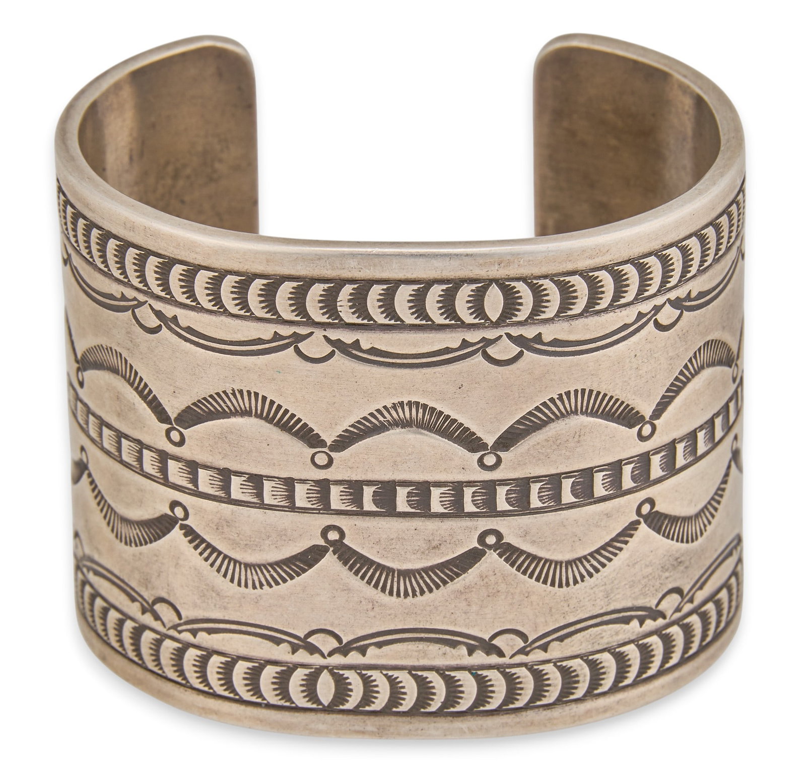 Robert Chee, Navajo Sterling Silver Cuff: Robert Chee, sterling silver cuff bracelet, with rows of stamped details in geometric design, signed "Robert Chee" and marked "Sterling" Circumference: 6.75 in. Total weight: