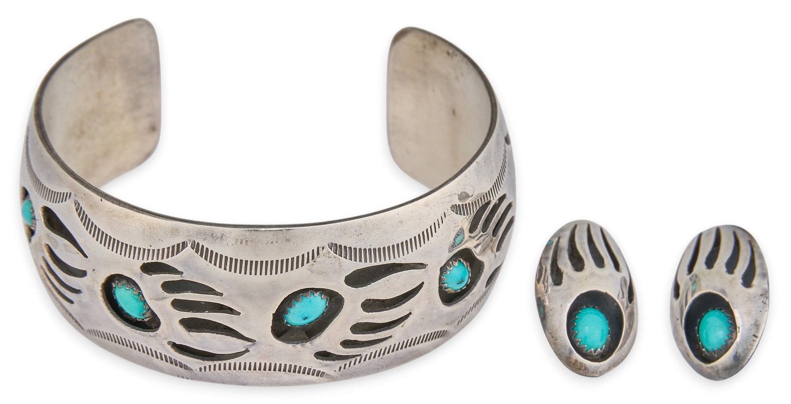 Pearline Spencer, Sterling & Turquoise Shadowbox Set: Pearlene Spencer, Navajo sterling silver cuff and pair of earrings, set with turquoise cabochons in bear paw shadowbox settings, and stamped details, marked "Sterling Pearlene Spencer" Circu