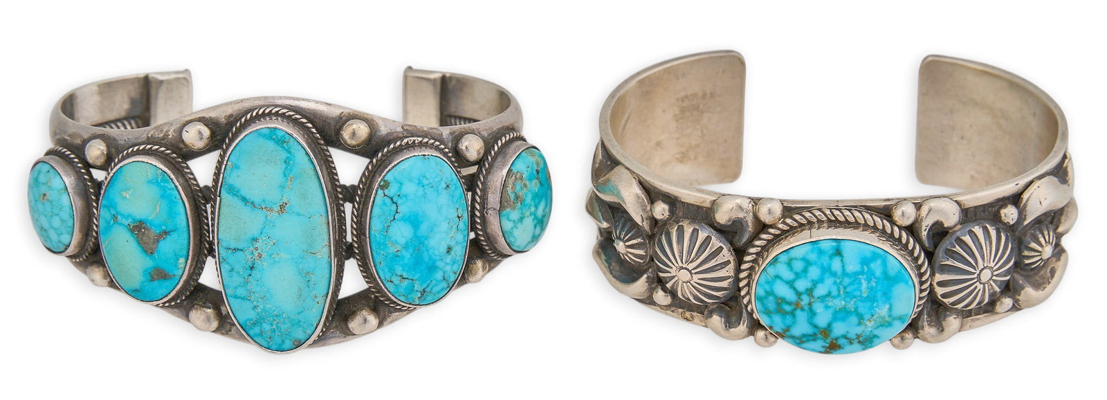 (2) Navajo Sterling & Turquoise Cuffs: Two Navajo sterling silver cuff bracelets, each set with turquoise cabochons, featuring twisted rope and stamped details, both signed and marked "Sterling" Circumference: 6.25 in. /