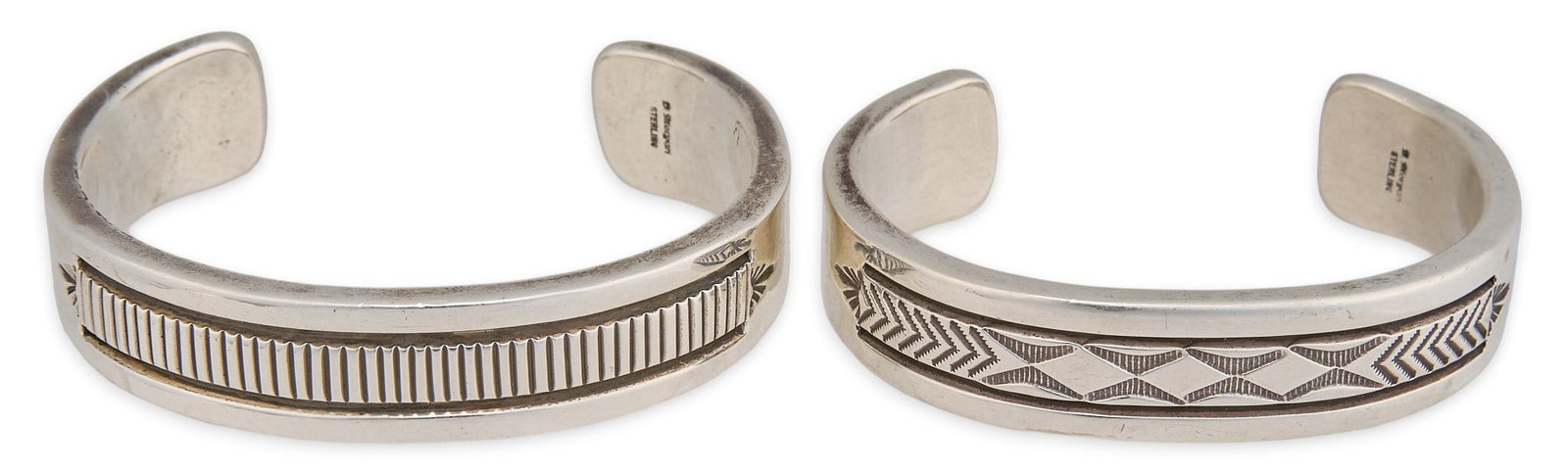 B. Morgan, (2) Navajo Sterling Silver Cuffs: Bruce Morgan, set of two Navajo sterling silver cuff bracelets, each featuring stamped details in geometric design, both signed "B. Morgan Sterling" Circumference: 8 in. / largest Total weig