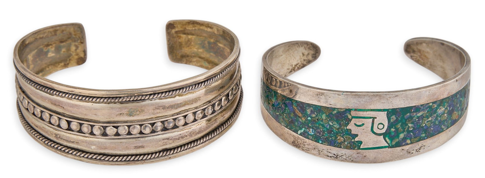 (2) Sterling Silver Cuffs: Two sterling silver cuffs, one set with turquoise chip inlay, one featuring twisted wire motifs, both marked Circumference: 7 in. / largest Total weight: 50.3 g Provenance: Property from a home in Dur