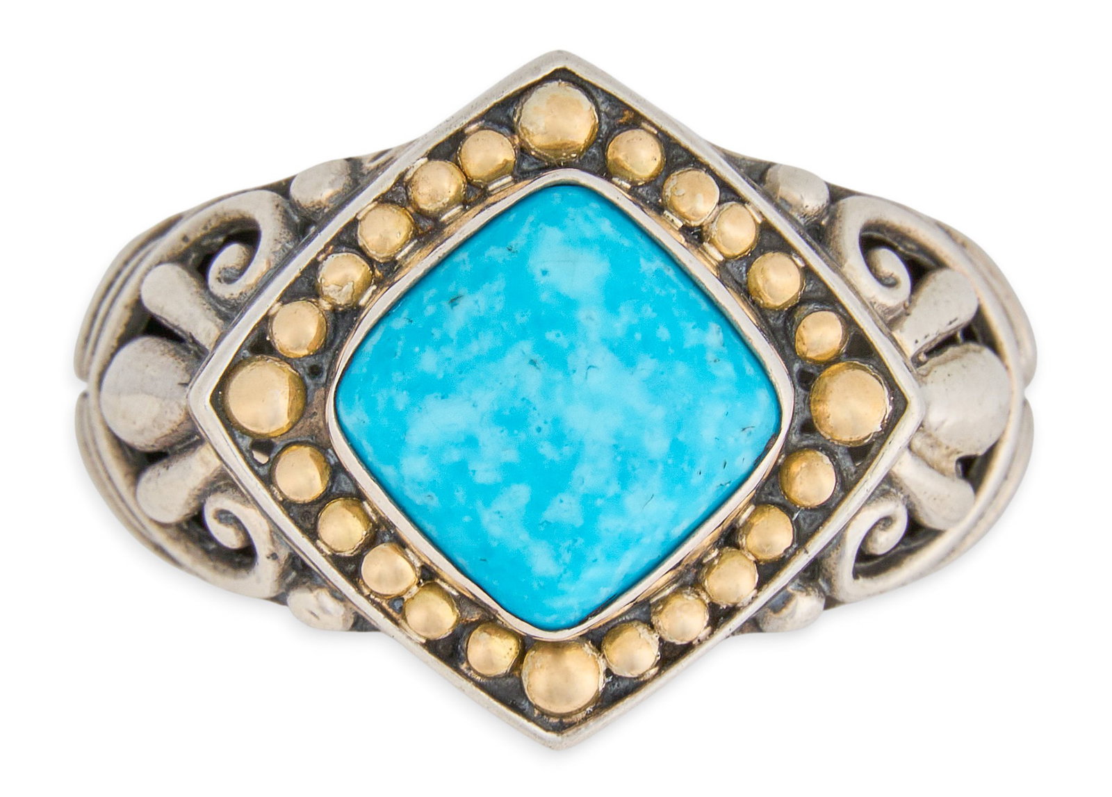 18K/Sterling Silver and Turquoise Ring: 18K yellow gold and sterling silver ring, set with turquois cabochon in bezel setting, with pierced details to shank, marked "925 18K M ID" Size: 9 Total weight: 10.4 g Provenance: Prop