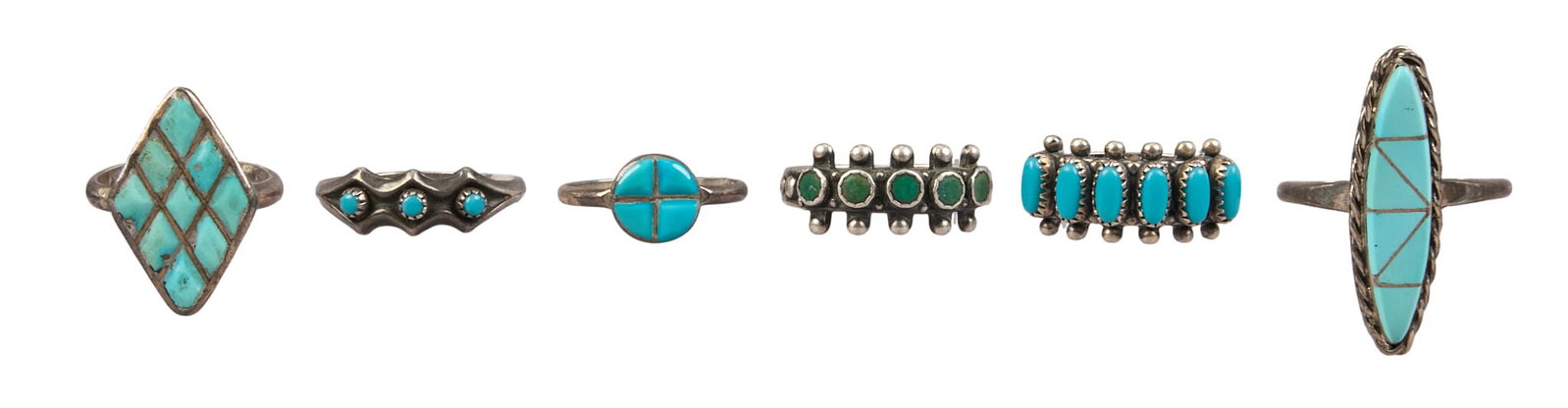 (6) Native American Sterling & Turquoise Rings: Six Native American sterling silver rings, each set with turquoise cabochons or inlay, various sizes and styles, marked "Sterling" Size: 5.5, 7, 7.5 Total weight: 16.2 g Provenance: Pro