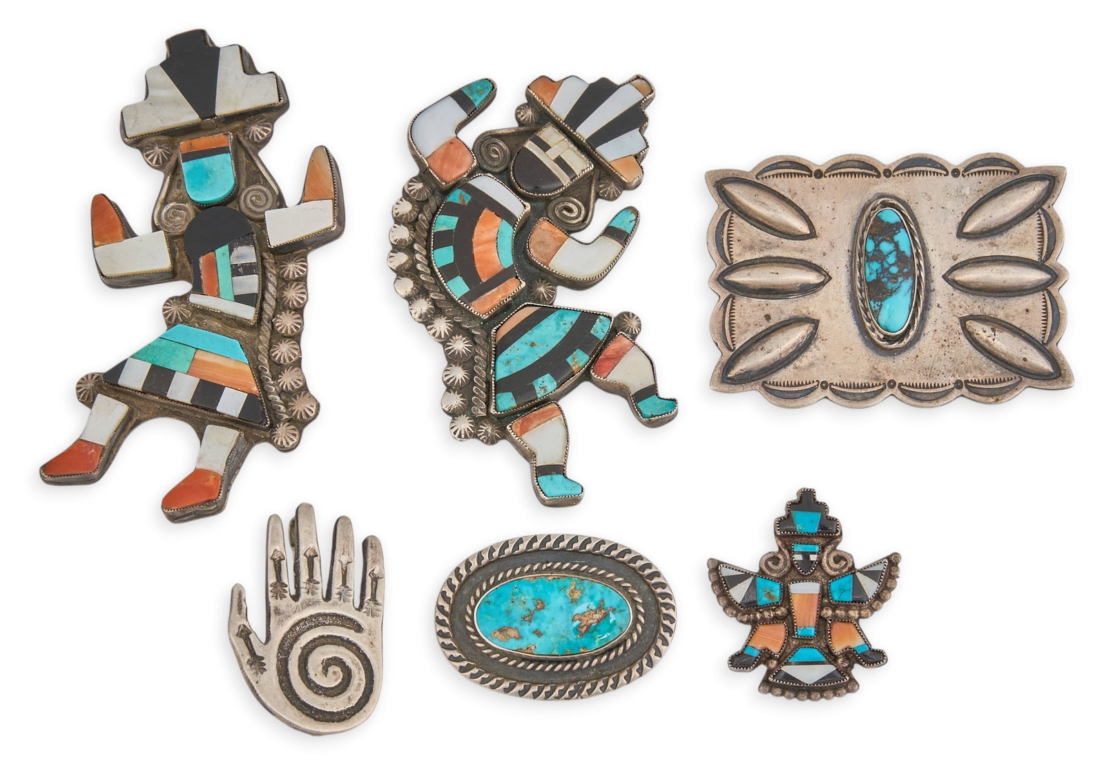 (6) Native American Multi-Stone Pins: Six Native American pins, including three Zuni pins and three Navajo pins, set with multi-stone inlay, depicting various traditional motifs, marked Size: 3 in. x 2 in. / largest Total