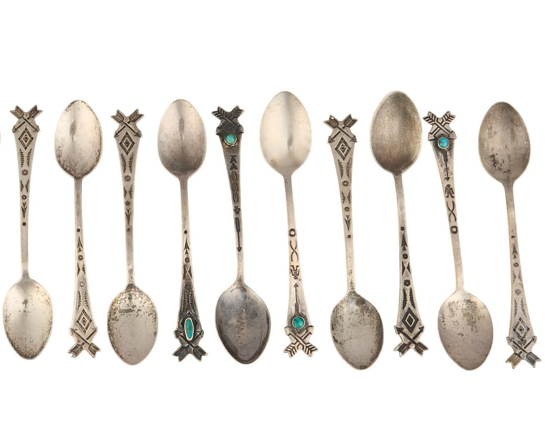 (10) Vintage Navajo Sterling Silver Spoons: Ten vintage Navajo sterling silver spoons with stamped details, four spoons set with turquoise cabochon, circa 1950s Length: 3.75 in. / each Total weight: 60.5 g Provenance: Property from