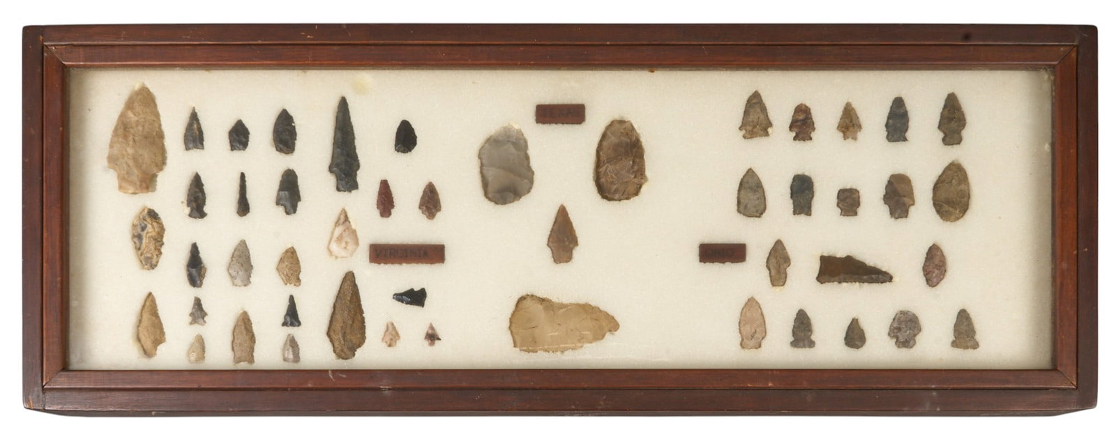 Framed Collection of (48) Primitive Points: Framed collection of (48) primitive points height 3 in. x width 38 in. x depth 14 in. / frame Provenance: Property from a home in San Antonio, Texas 