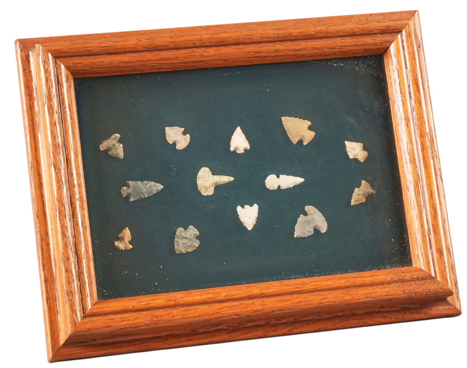 Framed Native American Bird Points: Framed collection of thirteen Native American bird points, dating pre-1600 height 6.5 in. x width 9 in. x depth 2 in. / frame Provenance: Property from a home in Tomball,