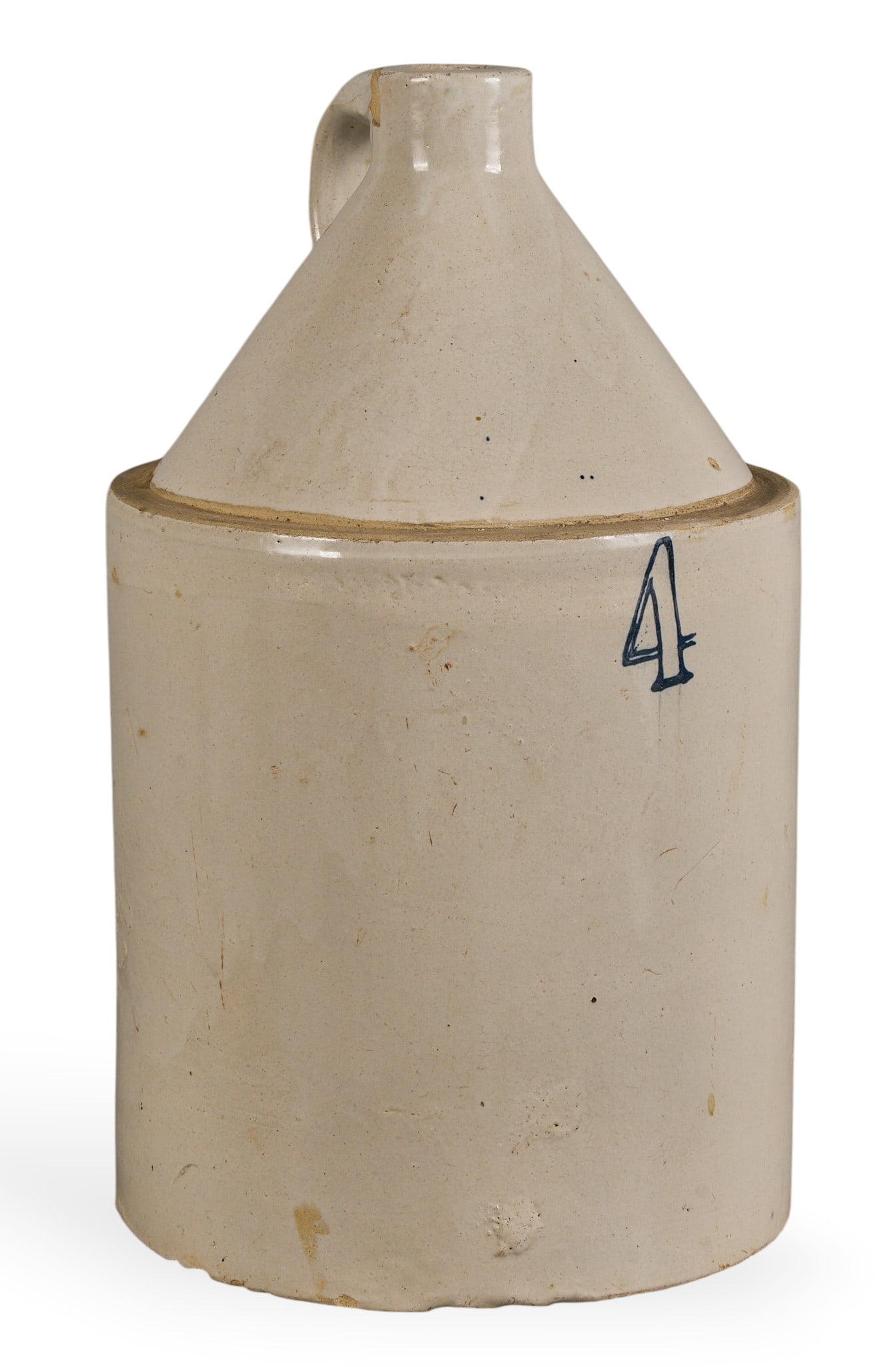 4 Gal. Stoneware Jug: Four gallon stoneware jug height 18 in. x width 10 in. x depth 10 in. Provenance: Property from a home in Tomball, Texas Condition: chipped at top
