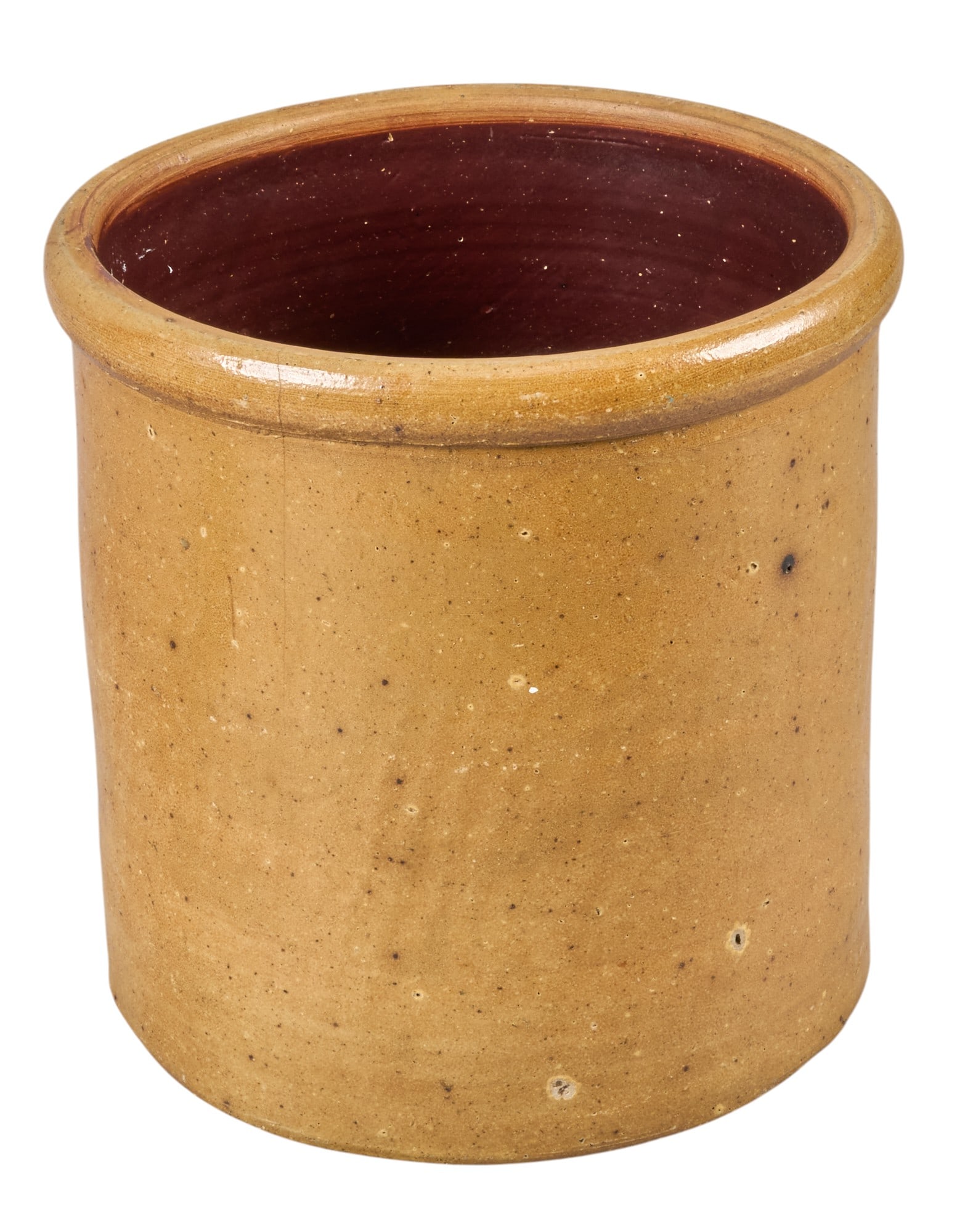 2 Gal. Texas Stoneware Crock: Two gallon Texas stoneware crock with brown glossy glaze height 10 in. x diameter 9.5 in. Provenance: Property from a home in Fredericksburg, Texas 