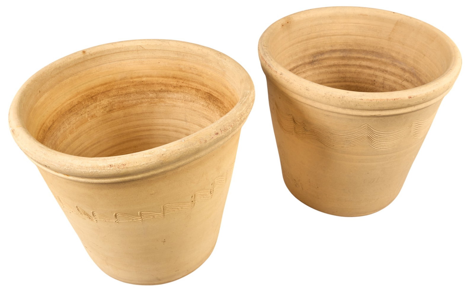 Pair of Texas Pottery Flower Pots: Pair of Texas pottery flower pots, not glazed, with incised design height 12.5 in. x diameter 14 in. / largest Provenance: Property from a home in Fredericksburg, Texas 