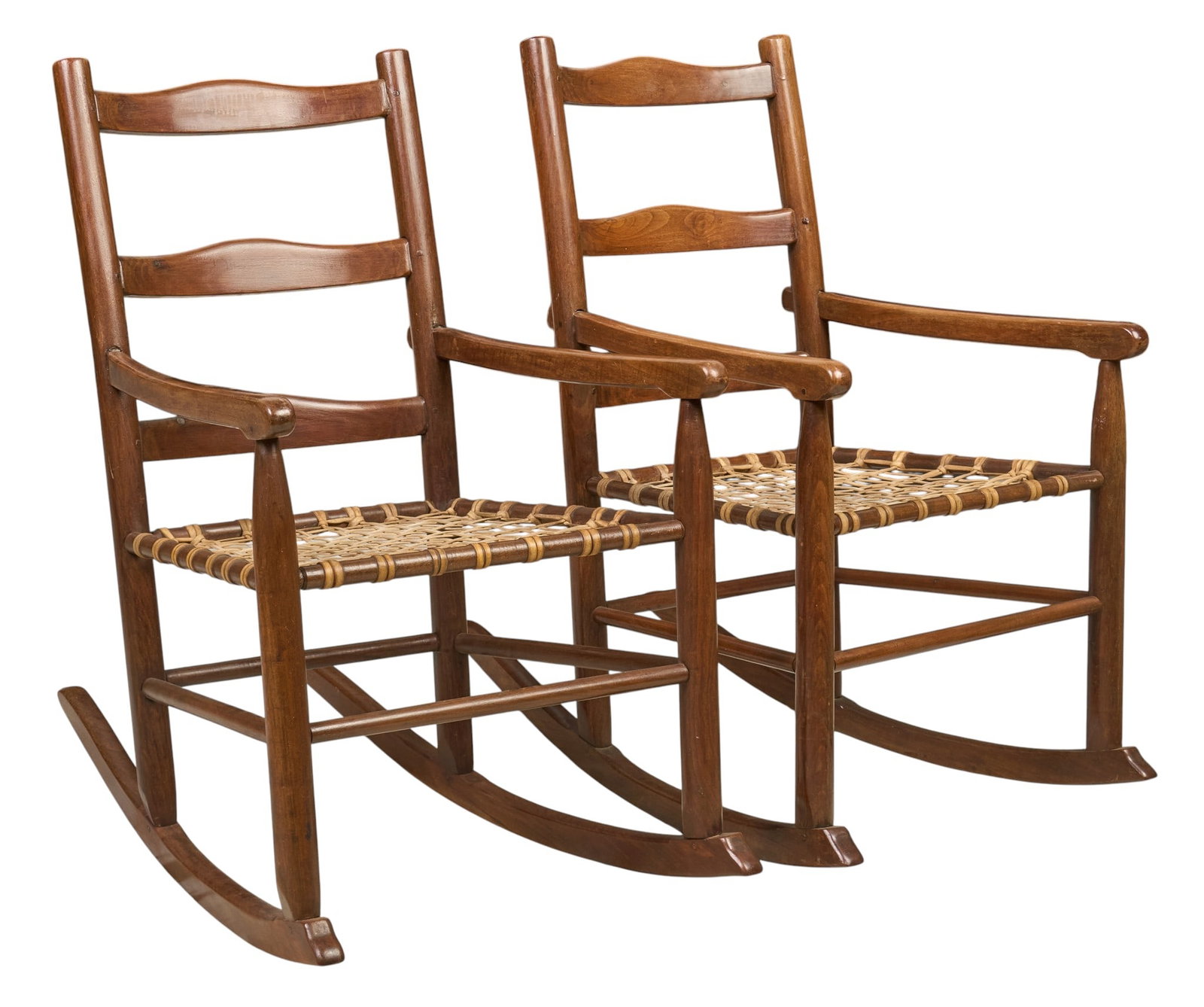 Pair of Ranch Style Rockers: Pair of ranch style oak rockers with woven chord seats height 38 in. x width 22 in. x depth 34 in. / each Provenance: Property from the personal law library of former King Ranch General Counsel and