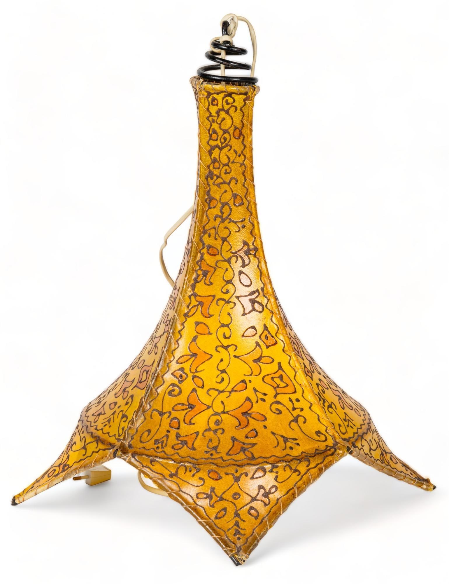 Vintage Rawhide Light Fixture: Vintage hanging light fixture, featuring hand stitched pieces of treated rawhide, with organic detailing height 21 in. x width 13.5 in. x depth 13 in. Provenance: Property from a home in San