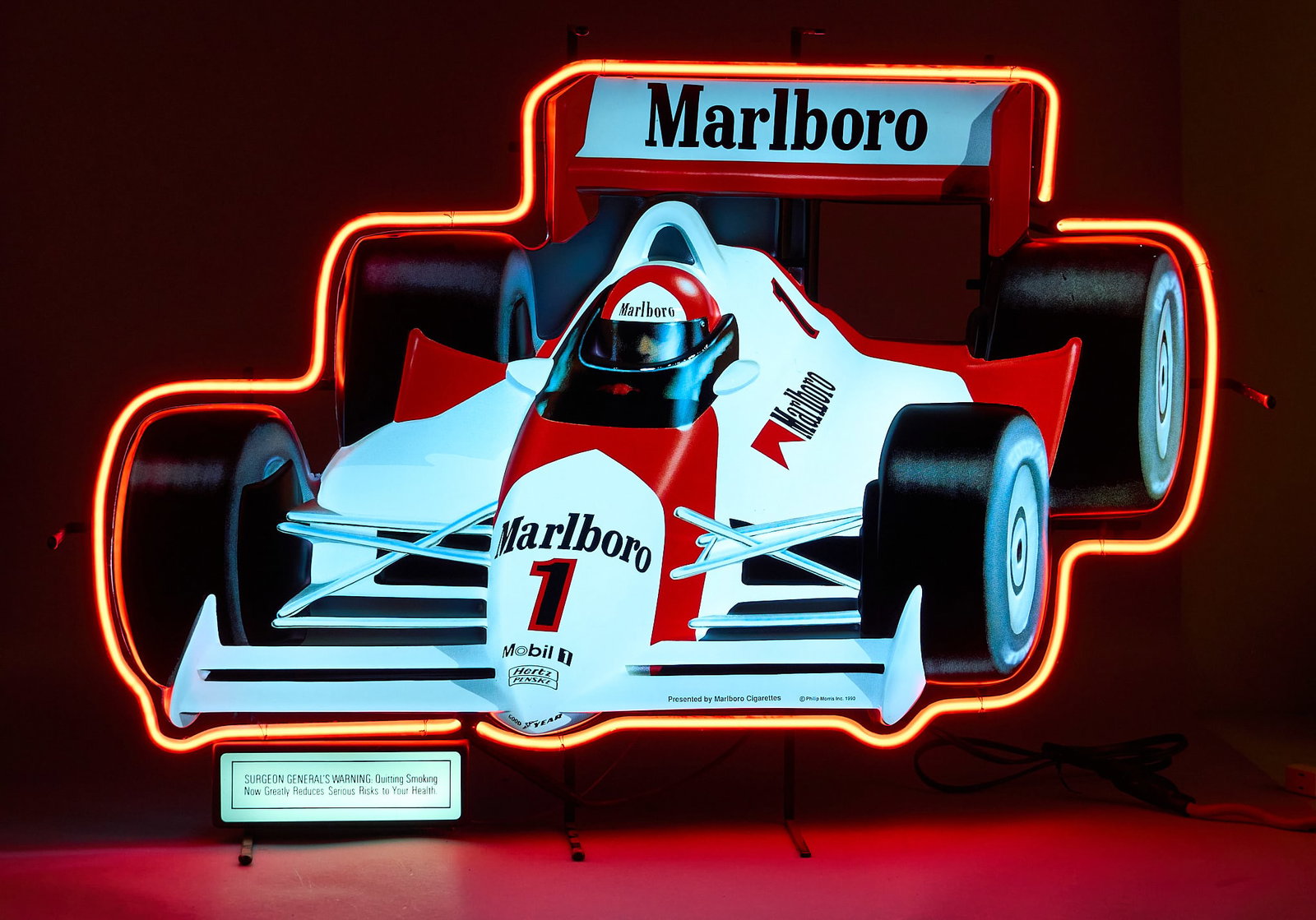 Marlboro Race Car Lighted Sign: Vintage 1990 Marlboro Formula 1 neon sign, dated 1990, in working condition height 28.5 in. x width 42 in. x depth 9 in. Provenance: Property from the collection of Linda Muth, from her ho