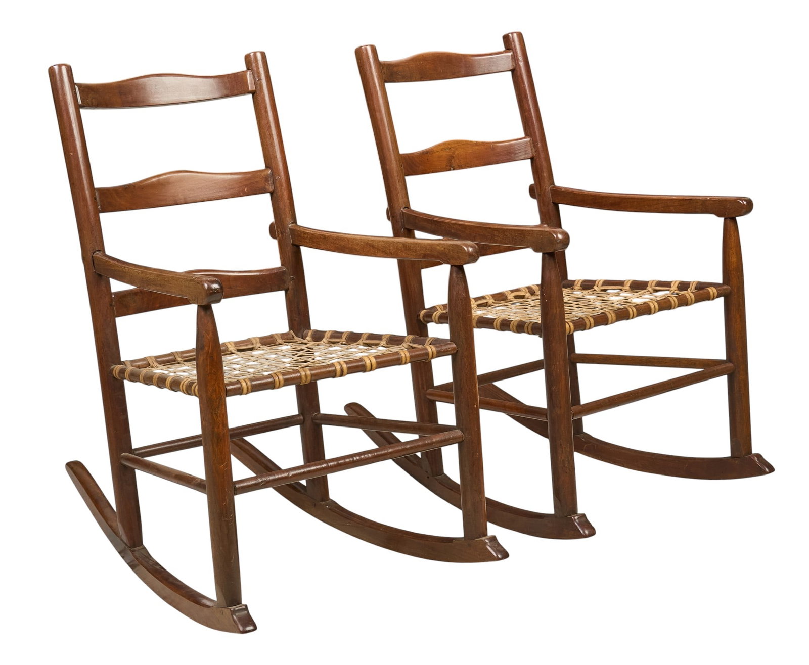 Pair of Ranch Style Rockers: Pair of ranch style oak rockers with woven chord seats height 38 in. x width 22 in. x depth 34 in. / each Provenance: Property from the personal law library of former King Ranch General Counsel and no